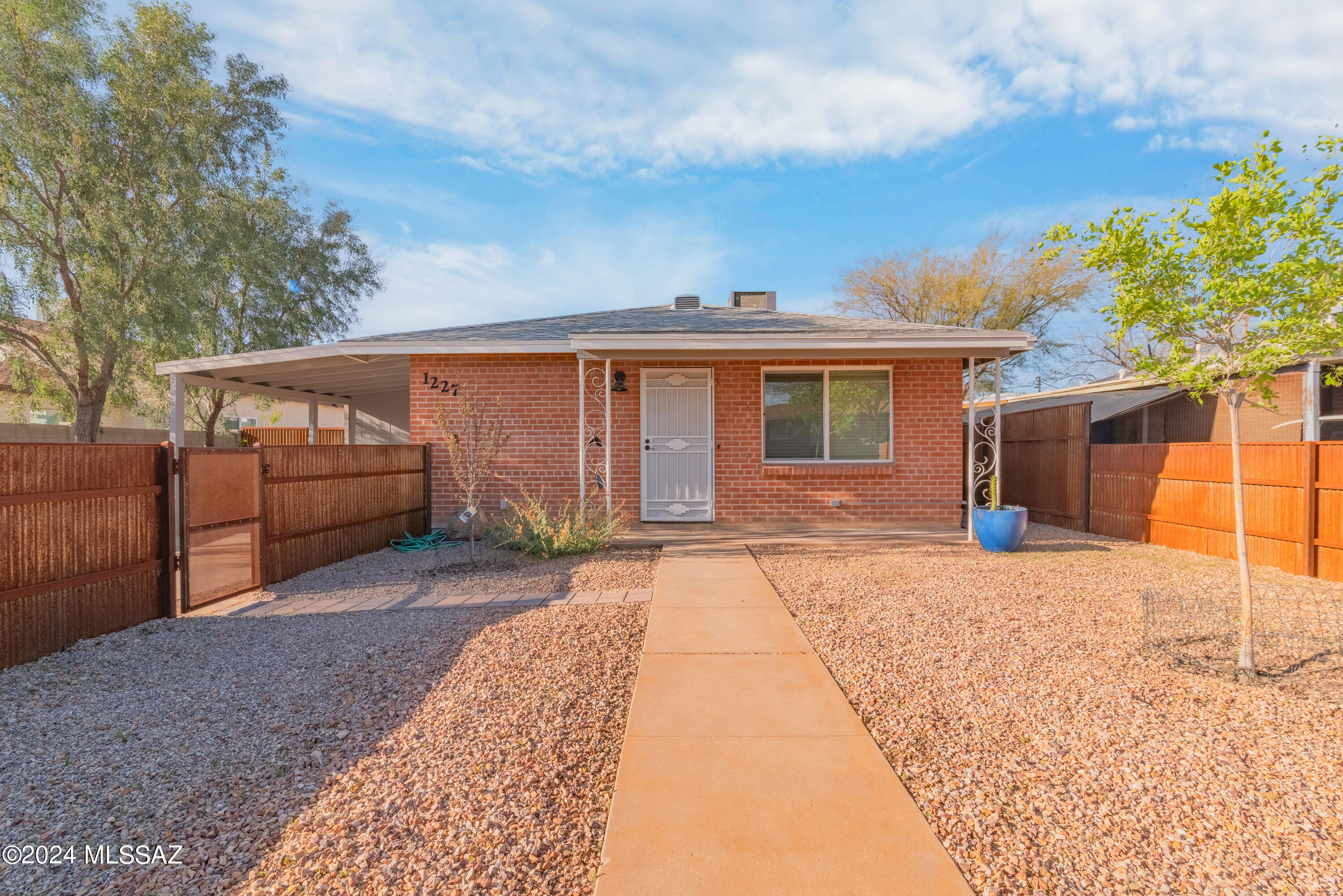 Now is your chance to own a home with a pool before summer hits! This mid-century beauty has been updated throughout and features an open-floor plan, granite countertops, all appliances are included, and it's move-in ready! That sparkling Pebble Tec pool looks inviting for a reason - it's been consistently maintained and cared for, and features newer pool pump equipment. Updated landscaping in the front and backyard, including an added concrete back patio pad, turf, trees, and custom stained metal fencing. With a 4th bedroom and an appealing central location, opportunities abound! Barely over half a mile to reach the U of A rec center; about a 4min bike ride straight up Highland Ave to reach the U of A; 1.3mi. to 4th Ave; and about 1 mile from Downtown.