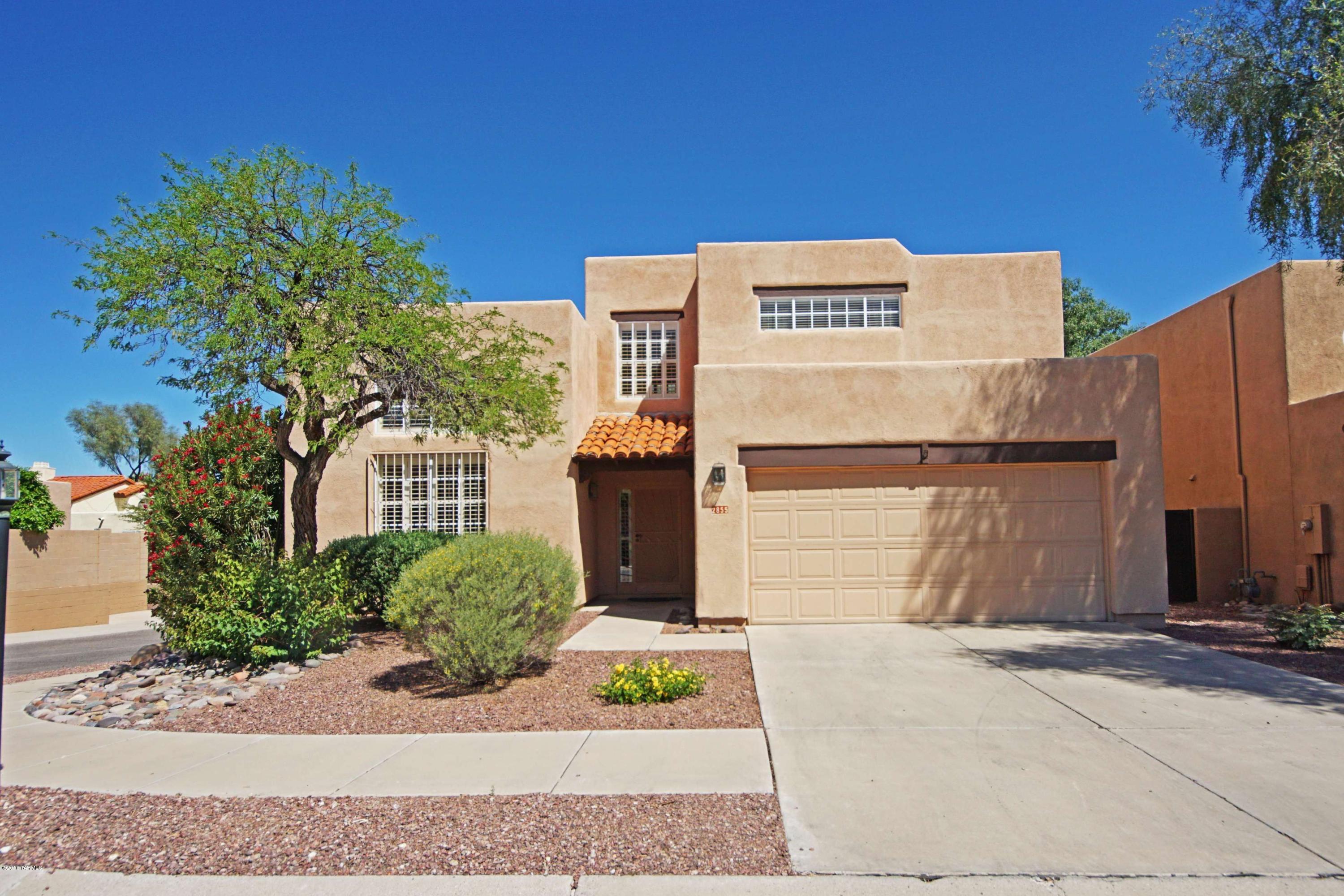 Attractive Southwest Santa Fe in Prestigious Cactus Allen Estates!  Beautiful saltillo tile floors, high ceilings, large LR w/FP, clerestory windows, open, spacious kitchen, plantation shutters, saltillo stairway with pine railings, master upstairs with 2 closets, separate shower & tub, private deck, private low-maintenance backyard with programmable drip system and shady covered patio.  HOA takes care of front yard.  Community pool and private tree-studded common area very close to the home.  Just a couple of blocks to Rio Vista Natural Resource Park with horse trails, cycling/walking/jogging on the loop.  Campbell eateries, UA and UMC all close at hand!