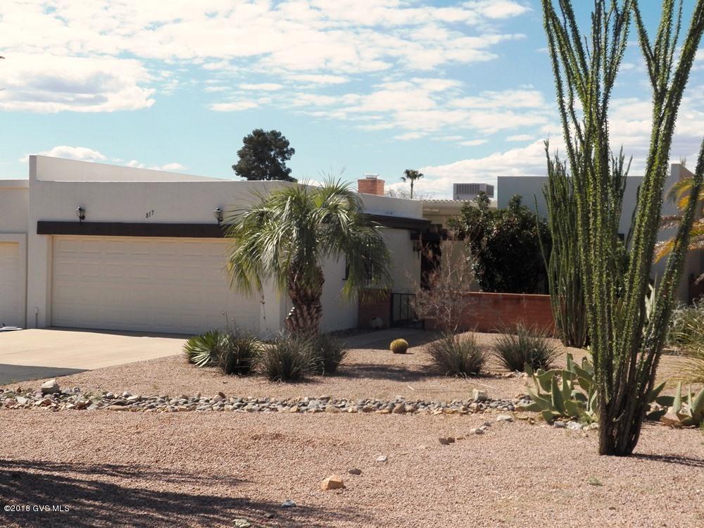 Awake to the sounds of the Sonoran Desert which borders the rear wall of this 2BR and den townhome. Nature, privacy and fabulous mountain views intertwine as you sip your morning coffee in the living room or in the office checking email. Both rooms open onto the rear patio. A newly paved driveway leads to an extended 2-car garage with a large front workshop area. This home transfers with a roof warranty and 3 year old HVAC system.