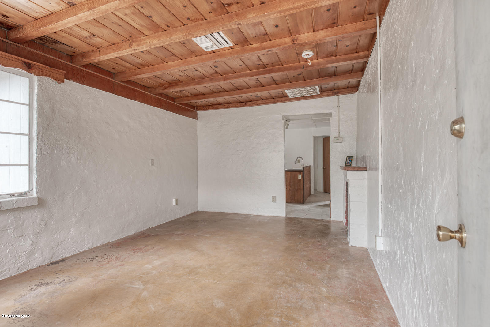 Historic Chicken/Egg Farm. Close to UA, Tucked away and hidden in a historic Pastime Acres neighborhood, right off Prince. 1 bed 1 bath w studio. Needs a bit of work. Not much though to make this an amazing place! Quiet Central location, but feels like you are in the country. On a huge, private R-2 lot. Great bones with tons of coolness potential. Beamed high ceilings, concrete floors, original knotty wood pine paneling.  Carport walls were enclosed without permit, and can be taken down for easy access for storage of your vintage Airstream. Build a Casita out back, or pull up a Tiny Home. Heat pump was installed 2005. 200 amp service installed 2006. Own a piece of unique history, and be sure to bring your chickens. Buyer is responsible to verify all information in this listing