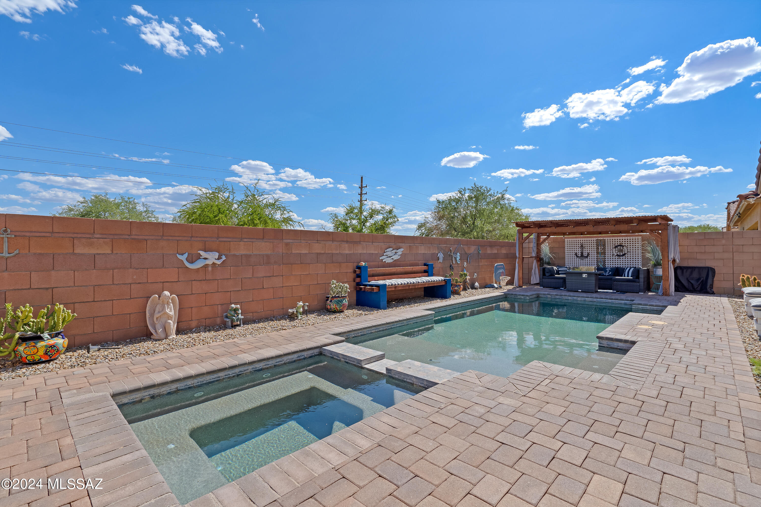 Price Adjusted! Now Range Priced at $429,000 - $439,000. This well-maintained 3-bedroom, 3-bathroom home features a next-gen suite with its own stackable laundry. Located in a quiet neighborhood, the property includes an upgraded storage shed and an Arizona room for added space. Enjoy Arizona's stunning sunsets and mountain views from your private saltwater, Wi-Fi-controlled heated pool with fun party lighting. This home offers comfort and convenience with thoughtful touches throughout—an inviting option for anyone looking to settle into a beautiful Arizona setting.