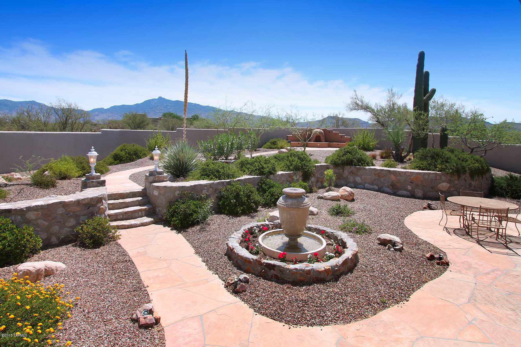 TAR HOME TOUR WINNER! Luxury living in secluded country setting!  This home has it all! Beautiful custom home on 4.25 acres of horse property. Priced 25K below recent appraisal! 4 Bed, 2 1/2 Bath w/bright & open floor plan & 360 degree views.  Great room w/cozy gas fireplace opens to magnificent back yard for year round entertaining.  Updated kitchen features granite counters, glass subway tile backsplash, high end S/S appliances (replaced 3-2015) dbl ovens, prep sink & breakfast bar, perfect for a family that loves to cook & entertain. Split bedroom plan w/huge master suite.  Sitting area in master opens to patio, enjoy morning coffee while taking in mountain views.  Relax in your spa retreat w/jacuzzi tub & walk in shower. Home wired for surround sound,inc oversized 3 car garage! NO HOA! One of the most wonderful rooms in the house is the sun room!  2 walls of windows plus separate entrance make this a perfect spot for a craft room, office, breakfast room, reading room....just let your imagination soar!  Epoxy seal coating on driveway, front & back porch, central vac, ceiling fans, kiva fireplace in back yard...the list goes on & on!! If you are looking for:  Elevated 360 degree views that overlook Coyote Creek, mountain views, privacy, serenity, horse property, RV parking & NO HOA...this is it!!