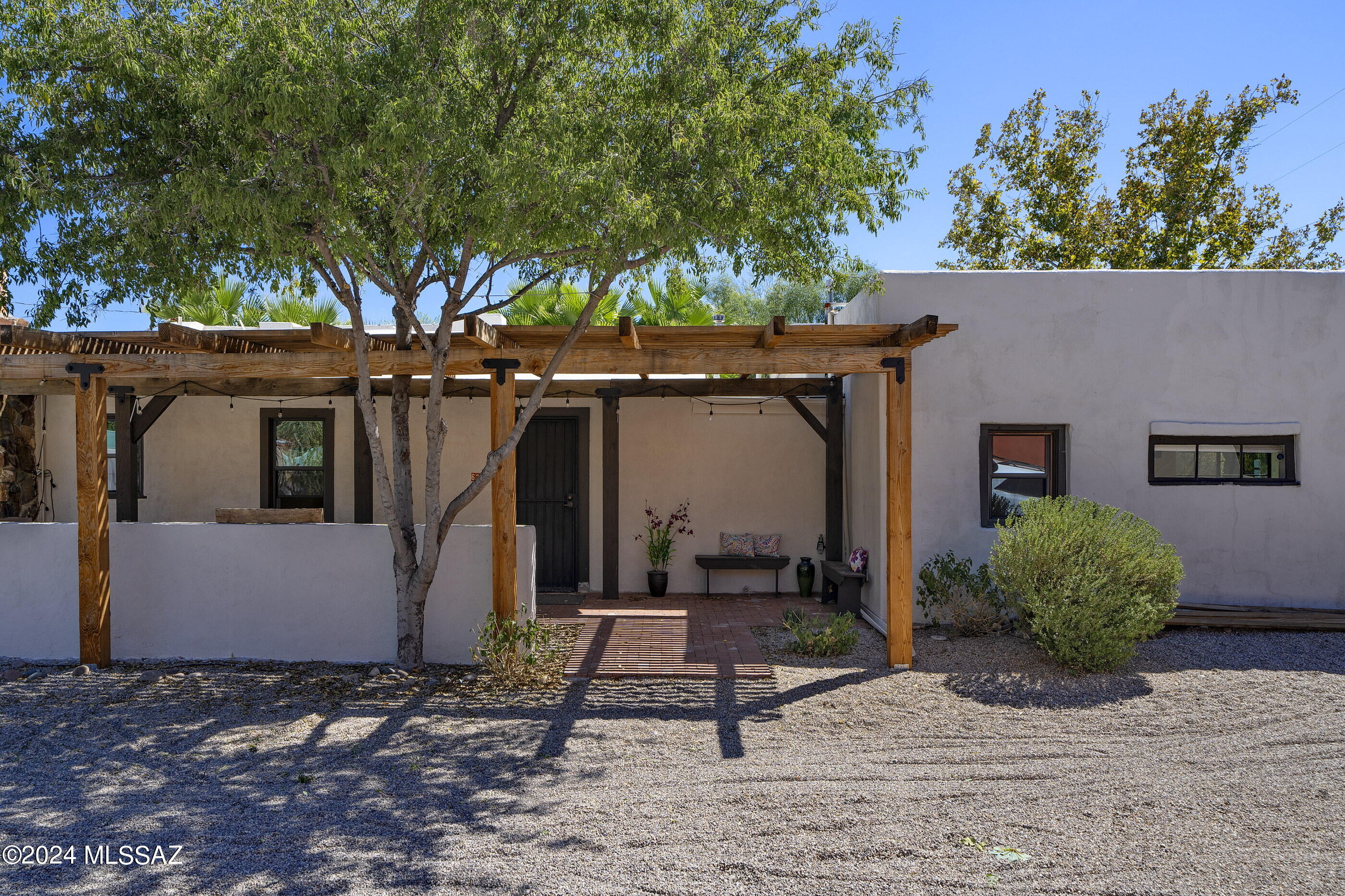 Step into this hidden gem, discreetly tucked away in the heart of the Historic Sam Hughes Neighborhood. Painstakingly restored by its previous owners, this charming residence honors its original details while seamlessly incorporating modern systems and finishes throughout. Featuring three spacious bedrooms, two-and-a-half beautifully appointed bathrooms, and generous storage, this home is both practical and exquisite. A perfect pied-à-terre, this home is just a short walk to the University of Arizona or the nearby Flora's Market Run. Enjoy multiple outdoor spaces, including a petite pool, shaded front porch, and brick patio surrounded by mature vegetation. The light-filled kitchen, with a window overlooking the pool, is perfect for enjoying the serene view while preparing meals. The rustic architecture evokes a provincial ambiance, while numerous upgrades provide modern comfort within one of the neighborhood's oldest structures.

Legend has it that the north side of the home was once the very first living quarters in the Sam Hughes area, used by cattle-tending cowboys over 100 years ago. This unique historical connection adds depth and character to the property. Additionally, this residence is part of the National Historic Register, qualifying it for a property tax reduction when used as a primary residence.