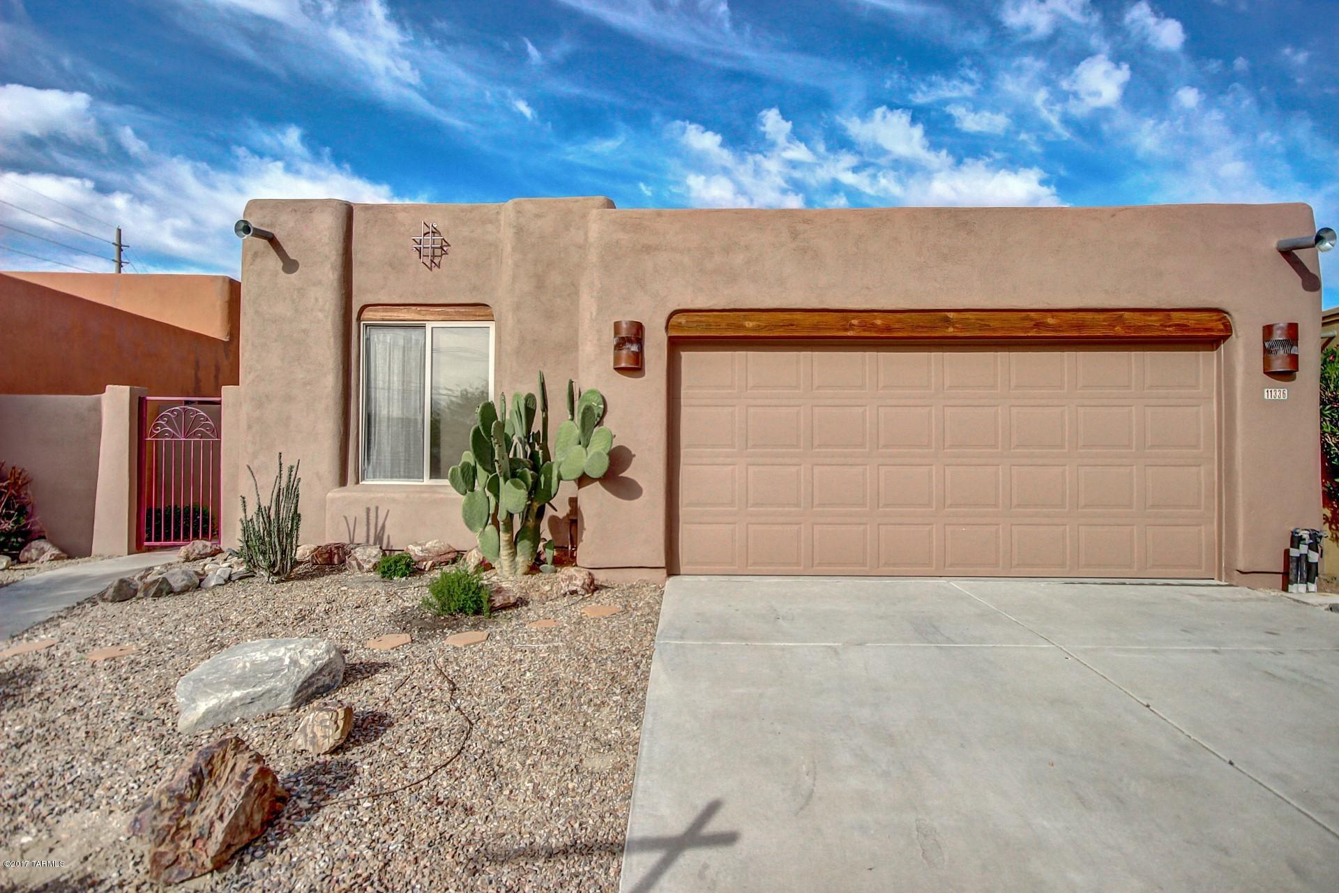 Adorable Oro Valley home located in a cul-de-sac with Mountain Views. This home offers Luxury Living in small enclave of TJ Bednar homes that rarely come on the market. The exterior of the home was recently painted, new windows in the kitchen and dining area. The  Backyard has a covered patio with extended pavered area and sidewalk, built-in planter area, plus the views of those spectacular Catalina Mountains. The great room with beehive Fireplace and soaring vega beam ceilings was designed with entertaining in mind. Also the split bedrooms is a nice add with the master on one side and 2 more bedrooms plus a full bath on the other. If you are looking for a great little home in Oro Valley this is a must see!