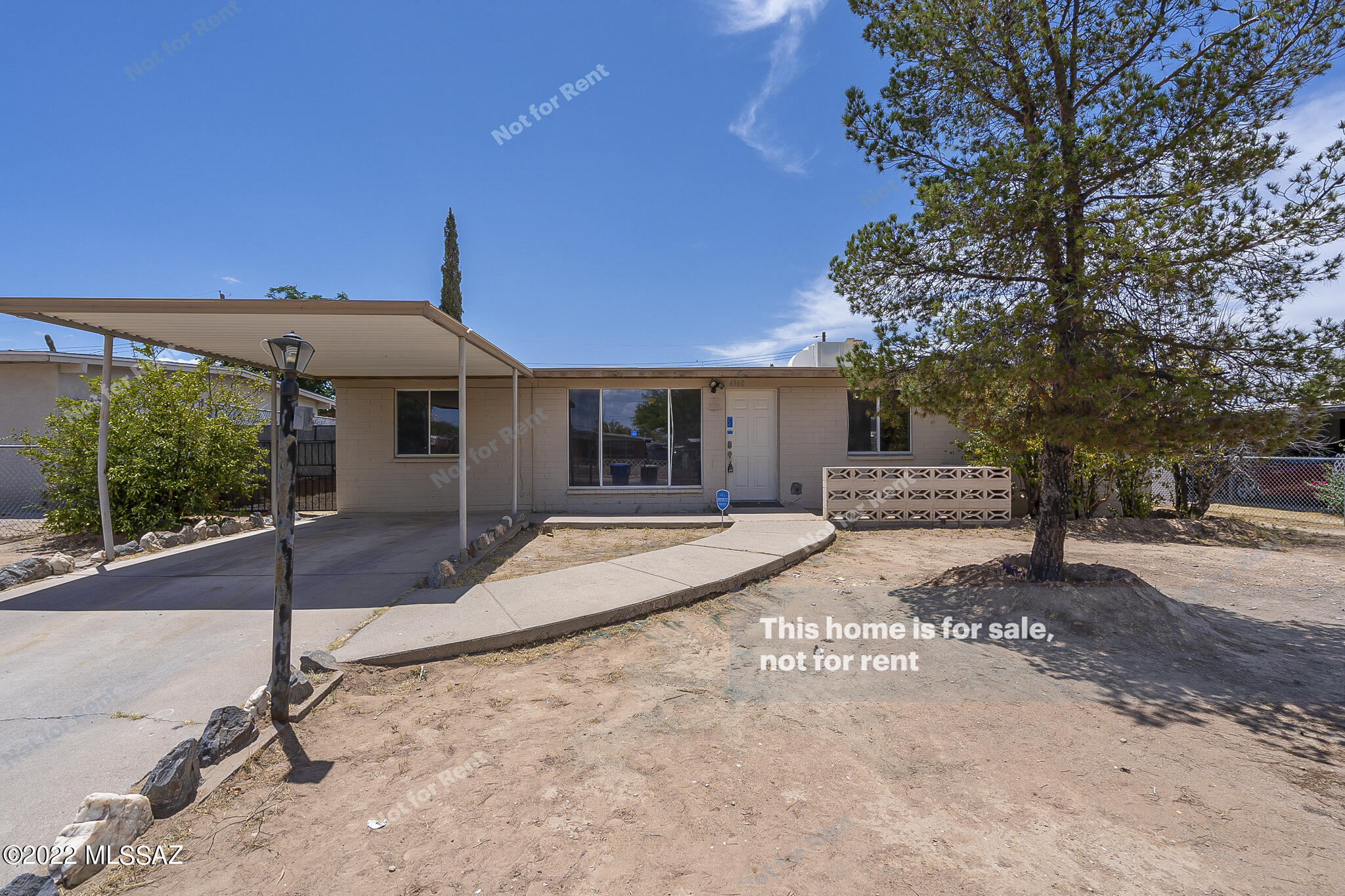 Come see this 3 bedroom 2 bathroom home in Tucson! The main living area features eye catching custom built in fixtures. The bedrooms are complete with plush carpet and ceiling fans. You'll want to spend all of your time in the back yard swiming in the in ground pool. The fenced in yard also has a paved patio area and a shed. Don't miss this opportunity! AC Freshly Installed.
