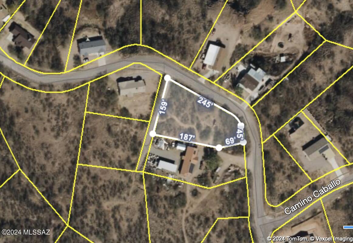 Introducing a remarkable vacant land opportunity in Rio Rico Estates! This .65 parcel of land is ready and waiting for your custom home to be built. With utilities conveniently located nearby, you can easily bring your dream home to life. Located in close proximity to schools and the interstate, this land offers a perfect balance of beauty and accessibility.