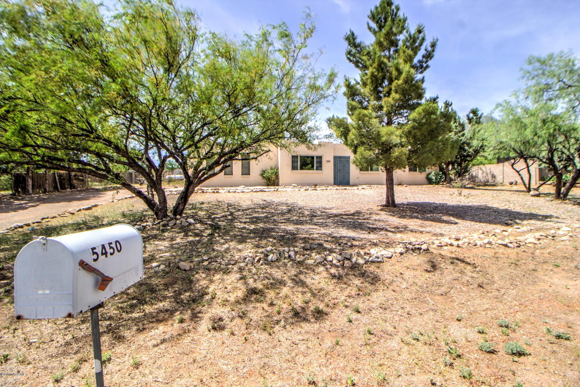 Wonderful family home with many improvements & upgrades. To include new windows & sliders 3 yrs ago, new heat pump/ac 3 yrs ago, roof w/reflective coating July 2017, new wood across entire back of house 2 mos. ago. Entire inside of home painted, newer side/by/side, bottom freezer. This is a charmer, with f/p in living room, garden room off dinning area. Yards front & rear are lush with trees, grass, shrubs, and views of the Huachuca Mtns., that make you think your not in the desert. This is a must see for the price and private location. ONLY 10 MINUTES FROM FORT HUACHUCA IN SIERRA VISTA, THIS WOULD BE A GREAT HOME FOR MILITARY FAMILIES OR BORDER PATROL. Garden room not included in Sq. Ft.