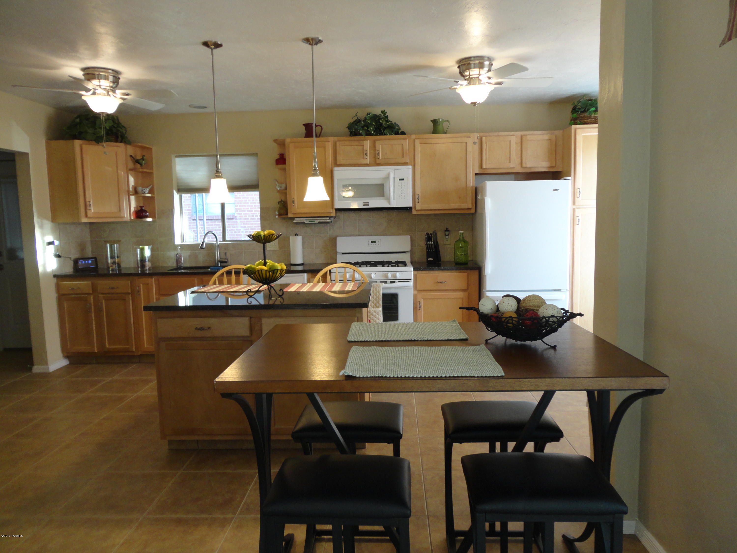 Beautiful remodeled/updated central home. Kitchen opened up to living room for a spacious open floor plan. New cabinets, granite & island w/appliances only 2 yrs old. New cabinets, fixtures & tiled showers in both baths, mst Ba has walk-in shower. New ceramic tile thru out. AC/heat new in 2005, 50% of elec upgraded 2008, all interior plumbing upgraded 2008, water htr new 2005. All new windows, doors, interior/exterior, lighting, fans, switches & outlets. Just painted inside & out w/new stucco outside. Storage/workshop plus extra storage shed. Close to restaurants, shopping, medical & Palo Verde Park. See attached document with list of all upgrades--too many to list!