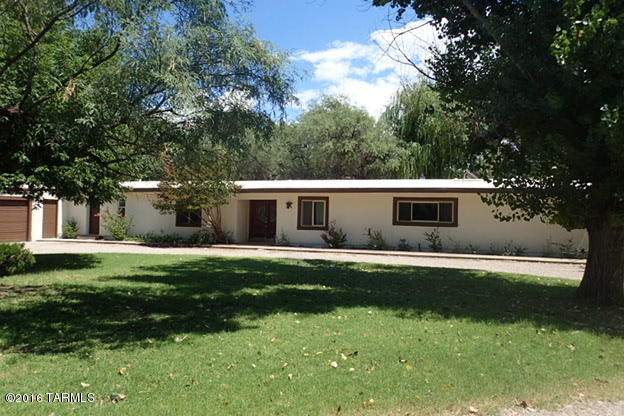 Contractor, car collector or Animal lovers delight nestled in a lush Mesquite Bosque. Large home with updated kitchen, huge master suite, polished flagstone floors and 1 bedroom guest house. 2 large metal buildings, pool, fish pond, chicken coops. Animal ready with fencing and cross fencing. House recently painted. Rural living near all modern conveniences.  Private well. 30x40 steel building could easily handle 6 cars or more.  20x30 metal building great for storage, hobbies, or animals. Apple, peach and pecan trees. Undeed restricted SR land.