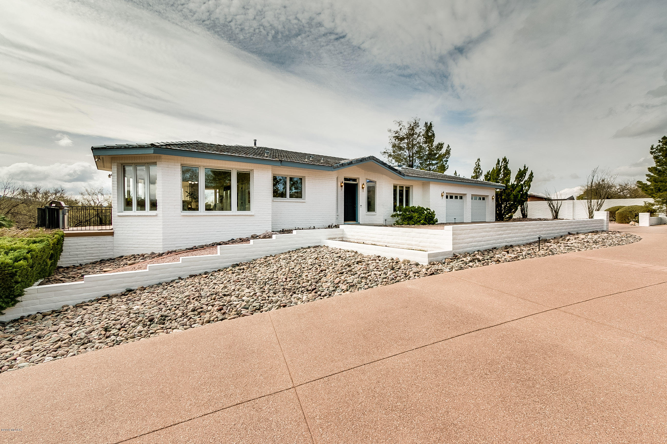 Bring your Family and pool toys too!  This prestigious 49ers Country Club “White House” is perched on an elevated lot with panoramic views which include the mountains and golf course.  Main house has 3 BR/3 ½ BA with over 3500 sf of living space & add'l 618 sf guest quarters. Oversized Great Room/Dining Room with built-in cabinetry and vaulted ceilings, AND a kitchen that's a DREAM.  Granite floors & countertops, NEW double convection ovens…yes TWO, new 5-burner gas cooktop, subzero refrigerator, warming drawer, Bosch dishwasher, and island with prep sink makes this kitchen ready for your inner chef.  The deck off the kitchen and dining room is perfect for outdoor entertaining and sunset viewing. The Pella windows make this home light & bright while also having built-in blind The guest quarters in the walk-out basement are perfect for visitors or in-laws.  It's 1 BR/1BA with living room and kitchen.  Need room for an RV...we have that too!  Not only is there a lift station, 30-amp service and water hookup, but parking pad as well.  The pool & spa have just been resurfaced and tiled, spa has a new heater...the sparkling water awaits you!  Be prepared to be WOW'd with the home automation...it's SMART!