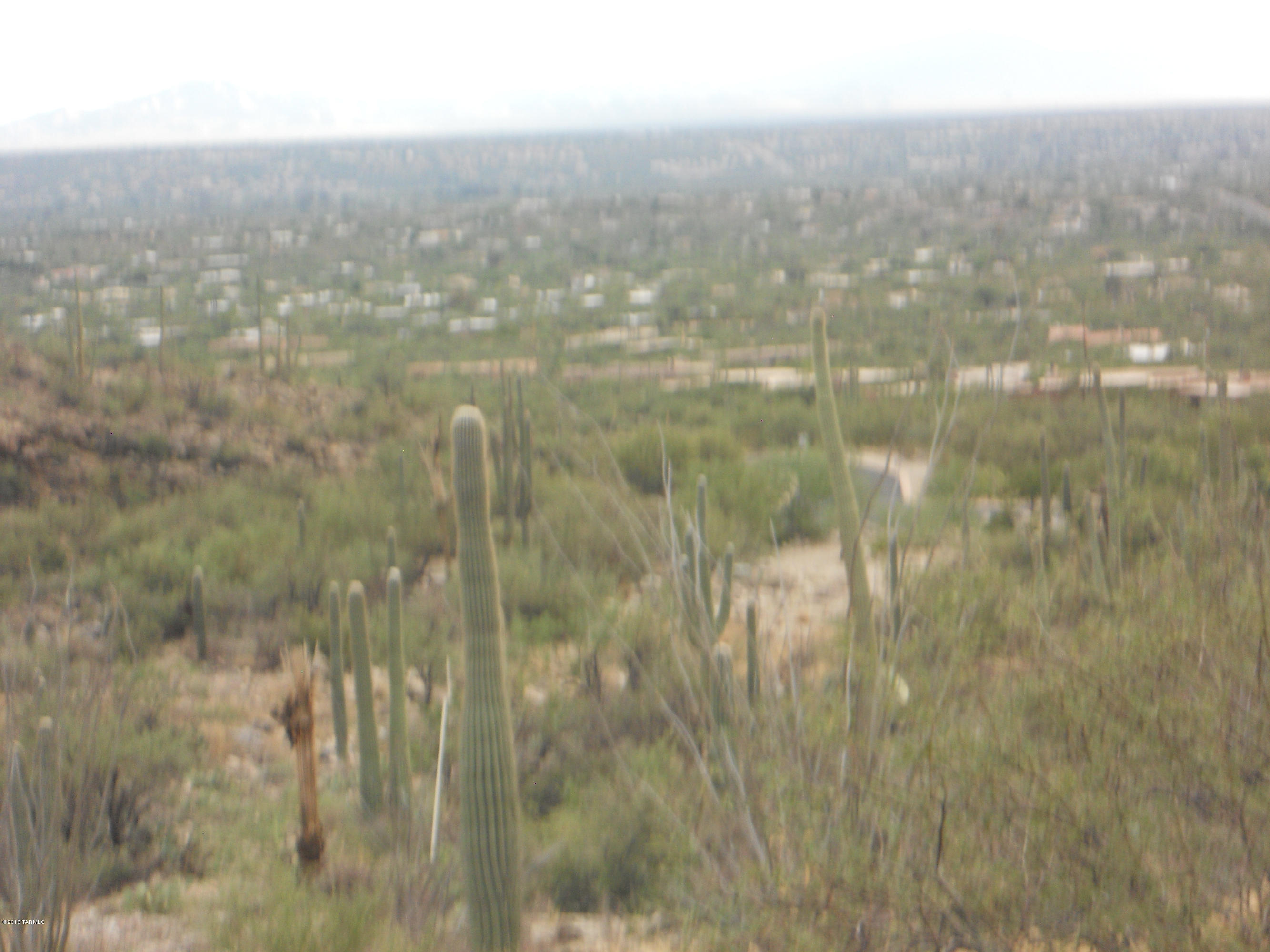 PRICED TO SELL. EXCEPTIONAL LOT BORDERING CORONADO NATL FOREST HIGH ABOVE THE TUCSON VALLEY. LARGE PARCEL WILL PROVIDE A WONDERFUL HOME SITE WITH AMAZING VIEWS OF THE SURROUNDING MTN RANGES AS WELL AS CITY. CLOSE TO AZ NATL GOLF. LOCATED IN PRIVATE GATED COMMUNITY & IS WITHIN AN ENCLAVE OF 9 TOTAL SITES WHICH ALREADY HAS MULTI-MILLION DOLLAR HOMES.  SELLER WILL FINANCE.