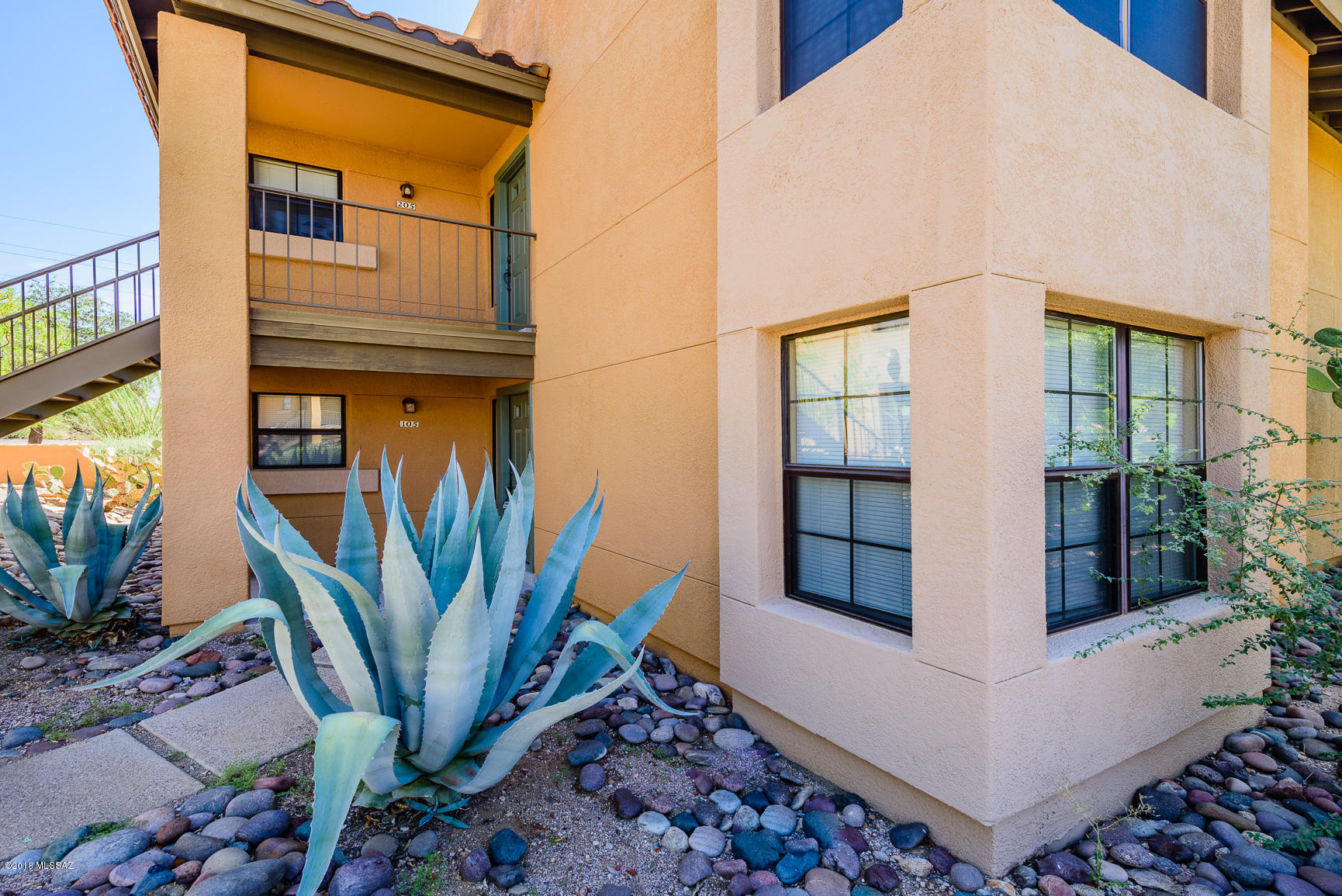 Catalina Foothills Luxury Condo with Majestic Mountain Views!! Kitchen - granite countertops, cherry cabinets, SS appliances. Wood-look tile throughout and cozy fireplace in family room. Spacious bathrooms with executive-height vanities. Walk-in closets! Covered back patio.  1 carport space. Community amenities include clubhouse, fitness center, pool, spa, and tennis court. Within walking distance to La Encantada shopping and dining! You just cannot beat the location, views and amenities! This is AZ living at its finest!