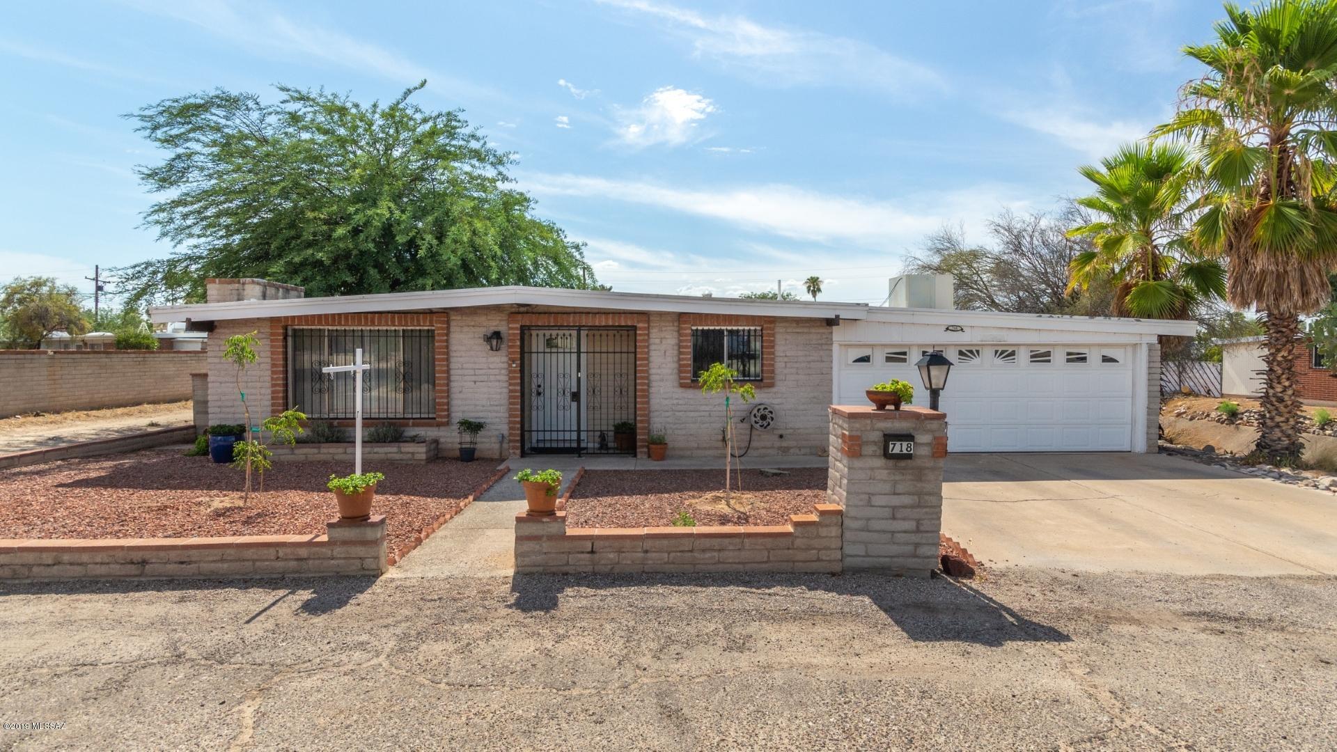 Come check out this awesome piece of property!  If you have toys and need space for storage; or if you simply do not want to have any neighbors, then this is the house!  From the moment you pull up you will notice the bonus parking out front that is off Camino Seco.  Upon entering the home you will enjoy the new flooring and completely remodeled kitchen.  This home is truly special and is a must see.  Do you like entertaining?  If so this home has a storage area in the front of the garage that has been converted to a wet bar as well as an oversized rear patio area. Do you need storage space?  The lot beyond the enclosed rear yard is included and offers plenty of room for anything that you may have.  You won't be disappointed in this .3 acre parcel that is updated and very private.