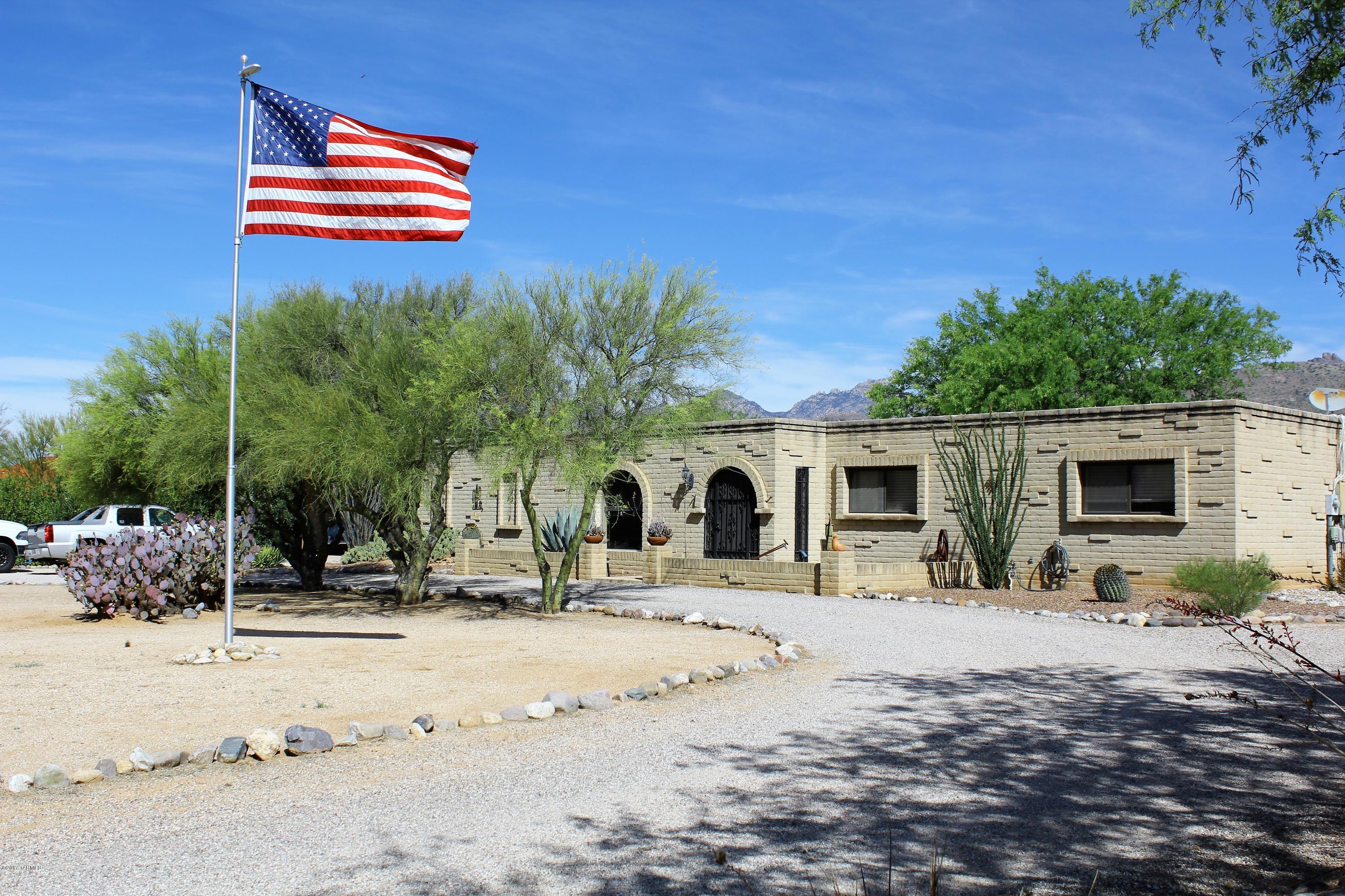 Well maintained and tastefully upgraded home in lovely Bel Air Ranch Estates. In the heart of Tanque Verde School District, this home boasts a four bedroom and two and a half bath floorplan on just over an acre of land. Captivating Santa Catalina Mountain views are the backdrop of the nearly half acre horse corrals and riding area. Yes, this home isn’t just a horse property, it is move in ready for you and your equine friends. After a morning spent in the corrals, rejuvenate in the relaxing pool and enjoy the evening in the superbly updated patio. The family room is warm and inviting with a lovely fireplace and gas insert with remote! Along with the family room, the living room is covered with local natural hardwood. This home is a horse lover’s paradise and is ready to be yours today!