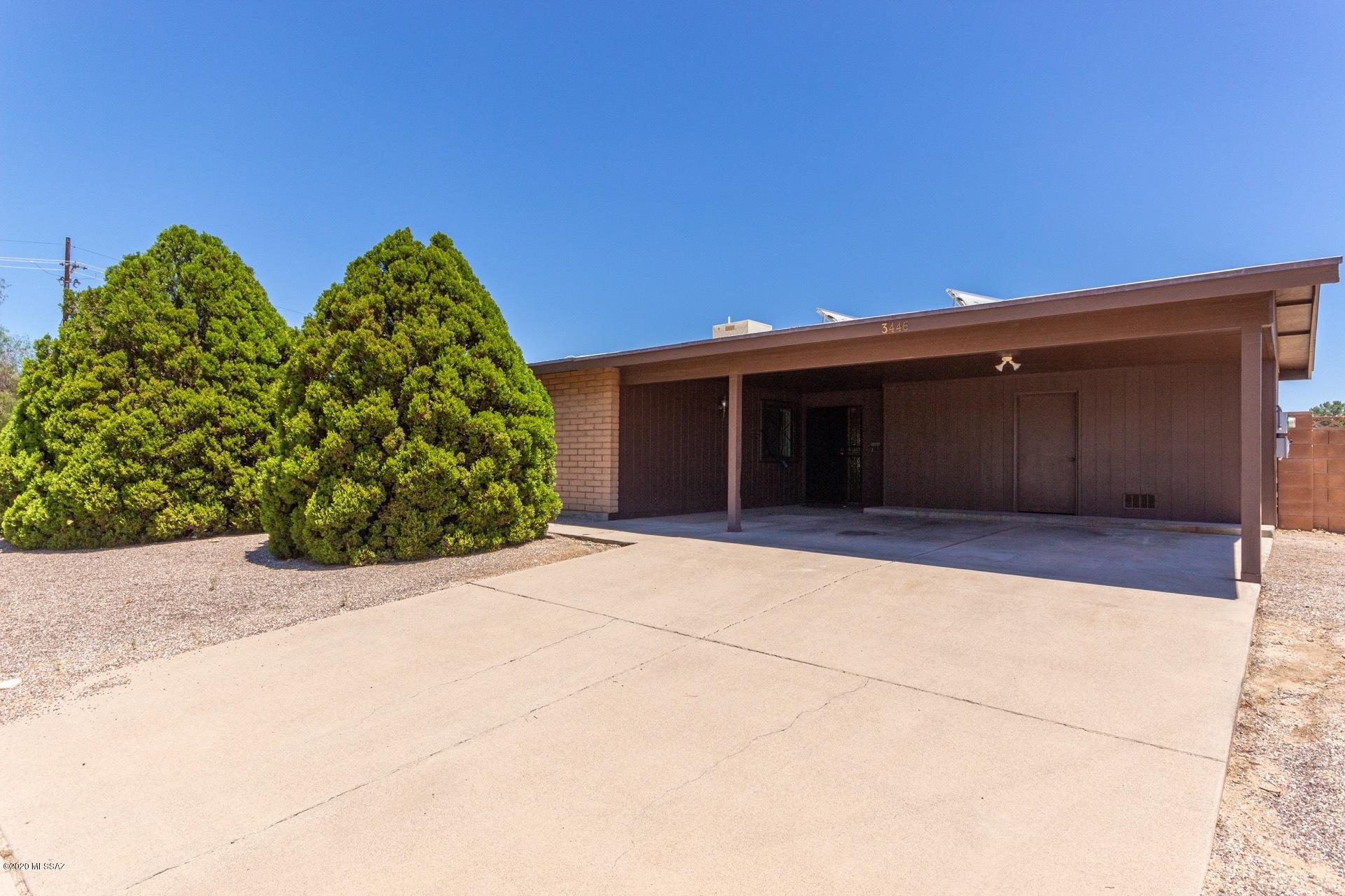 Fantastic block home that sits on a corner lot with Mountain Views in a great established NW neighbor. This home is very clean and has been well maintained by original owner. Roof has been recently recoated and and exterior painted. Nice 20' tile flooring thru out with remodeled showers in both bathrooms. This home offers very low utility bills with roof mounted solar panels that are OWNED and not leased. The large back yard is private and has room for whatever you want to do. NO HOA!