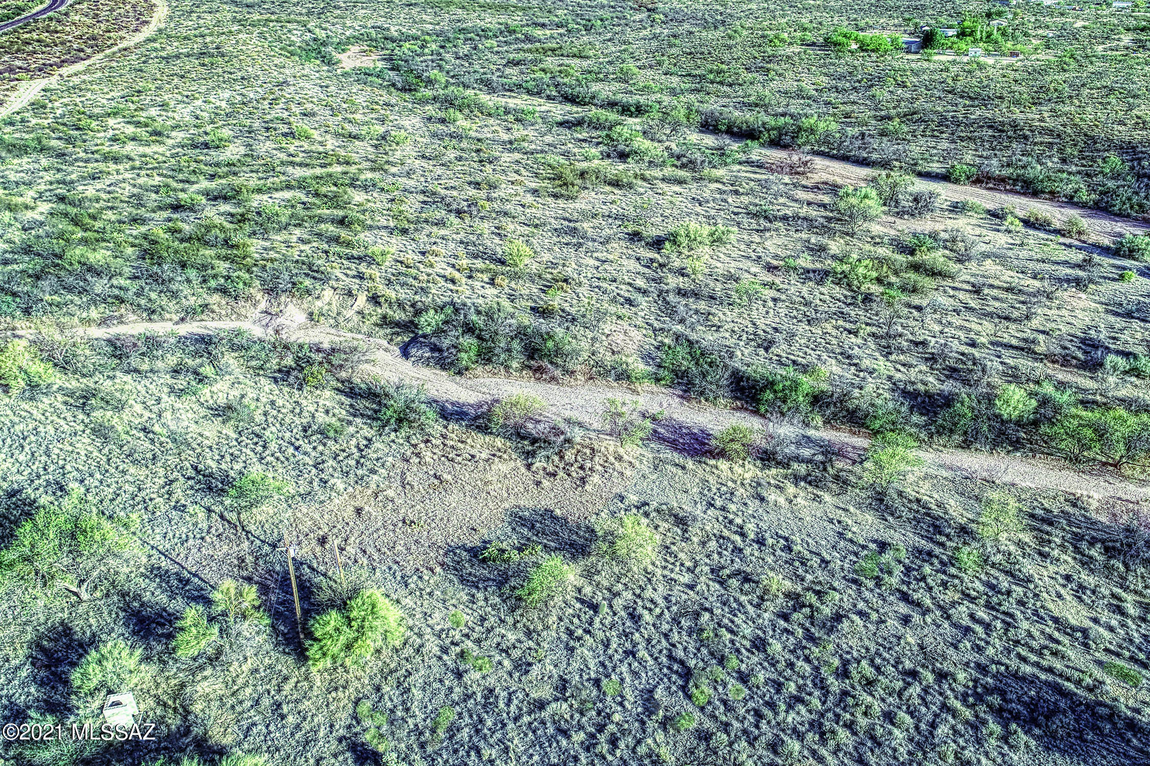 lush desert vegetation covers this lot....perfect for your secluded desert hideaway. Property includes well....