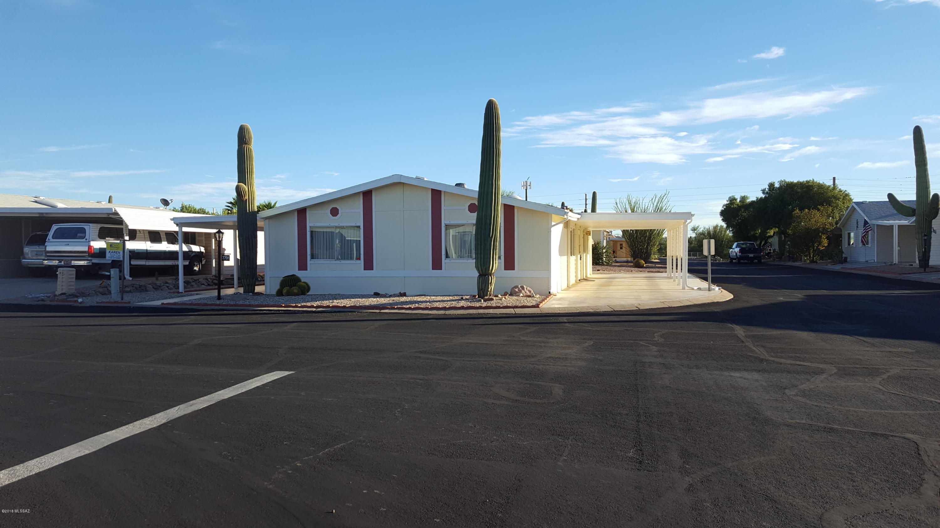 Check out this spacious great room plan with mountain view from covered patio. Updated (new texture) walls in kitchen and laundry. This light and bright split bedroom home includes built-ins, skylight in bath and workshop with sink. This 55+ active adult gated development backs up to state land and open desert surrounds the community!  COPPER CREST amenities include: recreational center, work-out facility, craft room, library and more!  Jr. Olympic-size pool and large spa. Outdoor activities include:  Bocce ball, water aerobics, shuffleboard, hiking (group-optional), biking and more. Visit CopperCrest.net for more info!