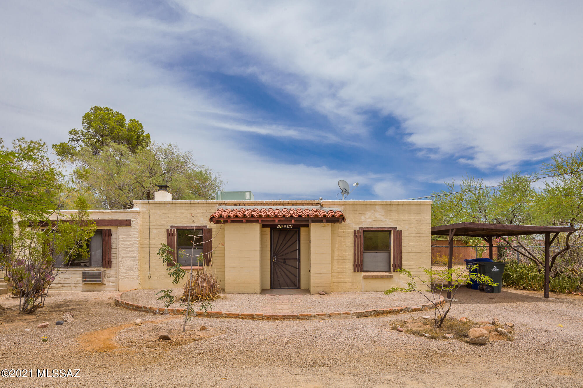 You will love this classic 1947 Tucson Bungalow. Set on a large 8712 square foot R2  lot, there are possibilities for another unit on the property. Inside, the tongue and groove ceilings, fireplace and marvelous built-in desk and bookshelves  warmly welcome you to another era. There is a big bedroom with access to the back porch, and another smaller bedroom that could be a perfect office. The kitchen is pretty much original and has access to the patio and block-walled yard. Ice cold A/C adds to your comfort. The roof was recently serviced by Roofsavers.  The gate on the NW corner of the house accesses the neighbor's property, so please do not disturb them. This little casita is a must-see!
