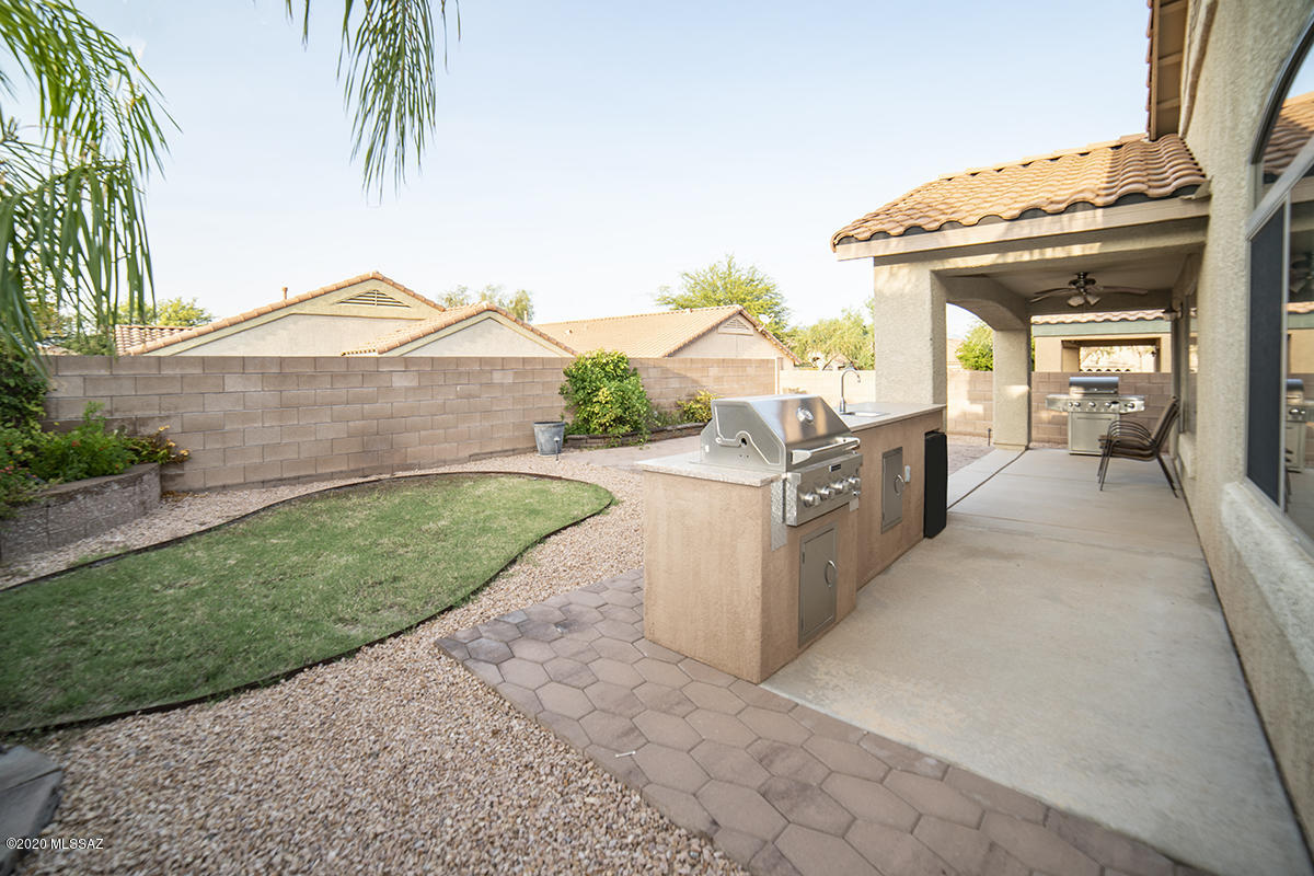 This CHARMING Lennar 3bd/2ba home AWAITS you. You'll spend ENDLESS time enjoying the  Fully Landscaped backyard with its OUTDOOR KITCHEN. Rooms are spacious and well spread out. Master Bedroom has Large walk-in closet AND normal closet for extra storage. Enjoy the Kitchen with its OPEN CONCEPT as you have HOST duties.  WON'T LAST!!!
