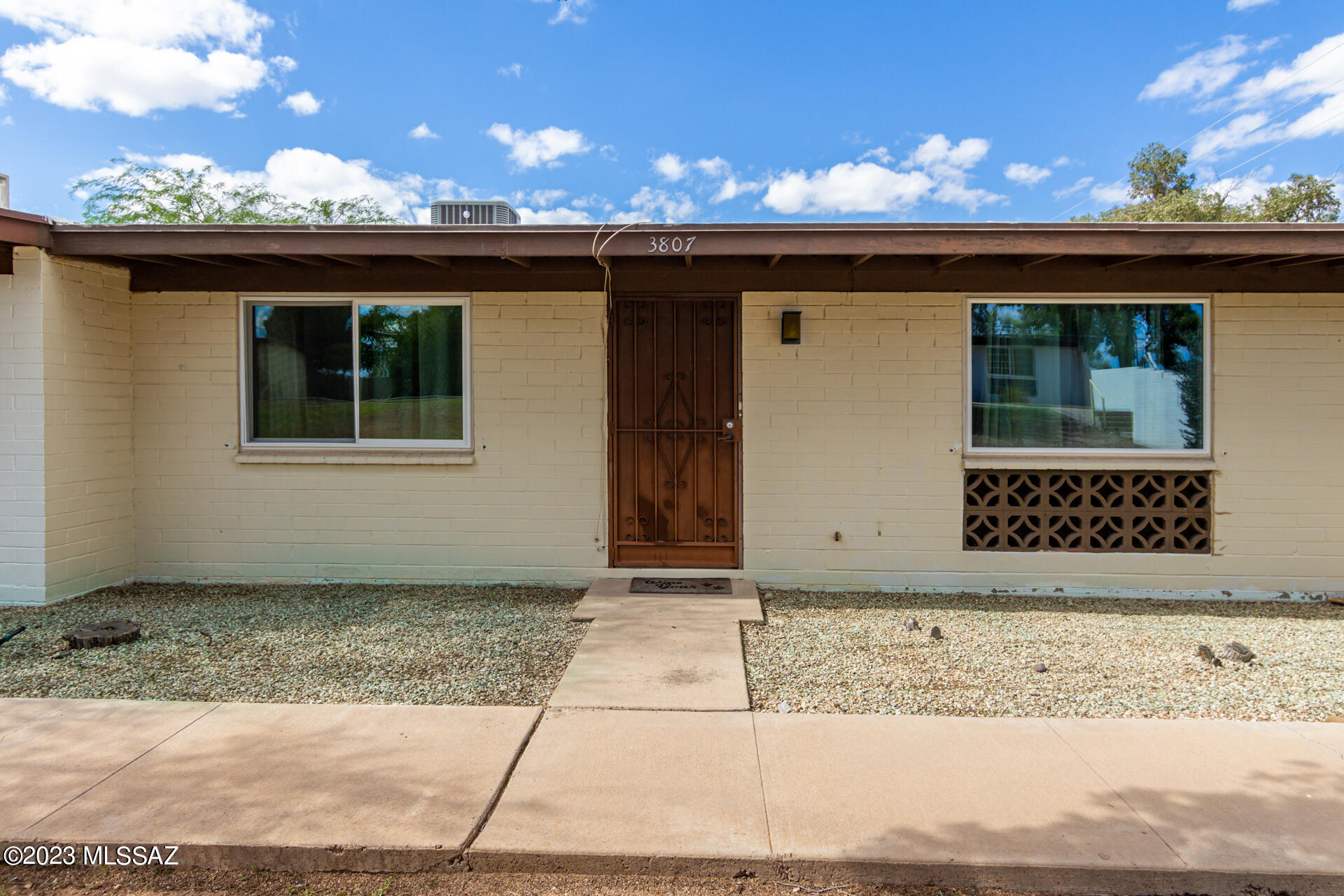 Lovely 2-bedroom townhome with a carport space in Palm Grove Community is finally on the market! Make yourself at home in this welcoming living room filled with plenty of natural light, exuding a warm and inviting ambiance. Tile flooring, ceiling fans, dual pane windows w/lifetime warranty, and designer palette are attributes you'll find. The large eat-in kitchen comes with ample cabinet space and sliding glass doors that open to the back patio. All sizable bedrooms will definitely give you a good night's sleep after an exhausting day. Continue onto the private backyard to discover a covered patio, pavers, and artificial turf, excellent for alfresco dining or entertaining! What are you waiting for? This deal won't last long!