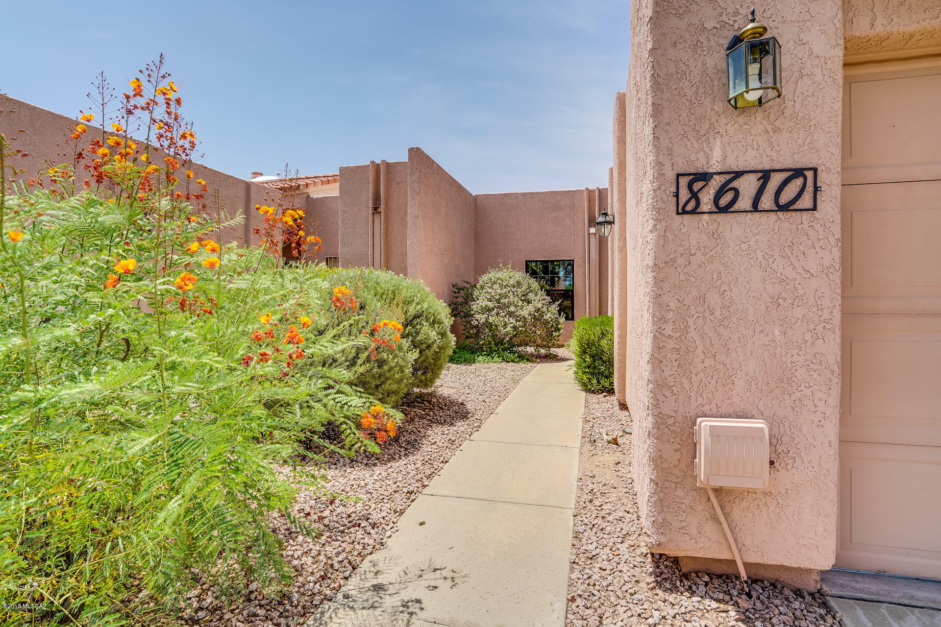 This sought after TH community of Wrightstown Sq. has it all!  Nestled in the Catalina Mtns. featuring yr. round heated pool & Spa, entertaining Gazebo,outdoor kitchen & lovely common area. Two bedrooms,two bath,Greatroom w/soaring ceilings,many architectural details,built-ins & sliders lead you to a generous back patio. Two car garage w/ room for storage & new epoxy flooring. Original owner, pride of ownership,immaculate condition, some upgrades needed. Freshly painted, no polybutylene pipes, newer mechanicals, A/C & roof..Great opportunity!