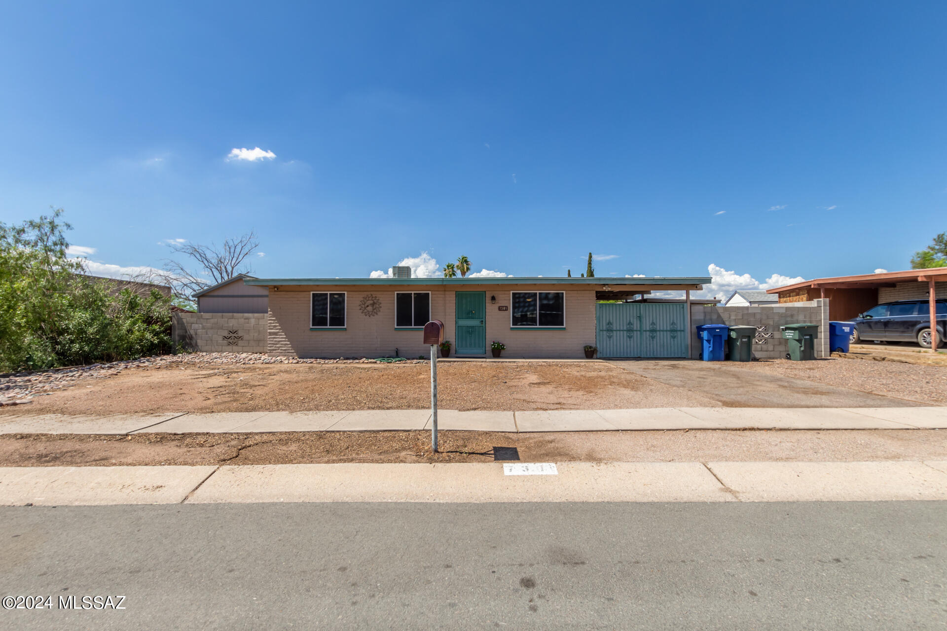 Check out this beautiful 3 bedroom / 2 bath home under $300k with A/C.  This home offers a large yard, carport, and block rear wall.  Inside you will enjoy the plank tile flooring throughout, updated kitchen, and dual pane windows.  Feel secure knowing that there are screens at the front door, rear patio, and master slider door. The  other front windows also offer security screens.   Conveniently located to shopping restaurants, freeway access, movie theaters, and Davis Monthan.  This is a lot of home for the money.