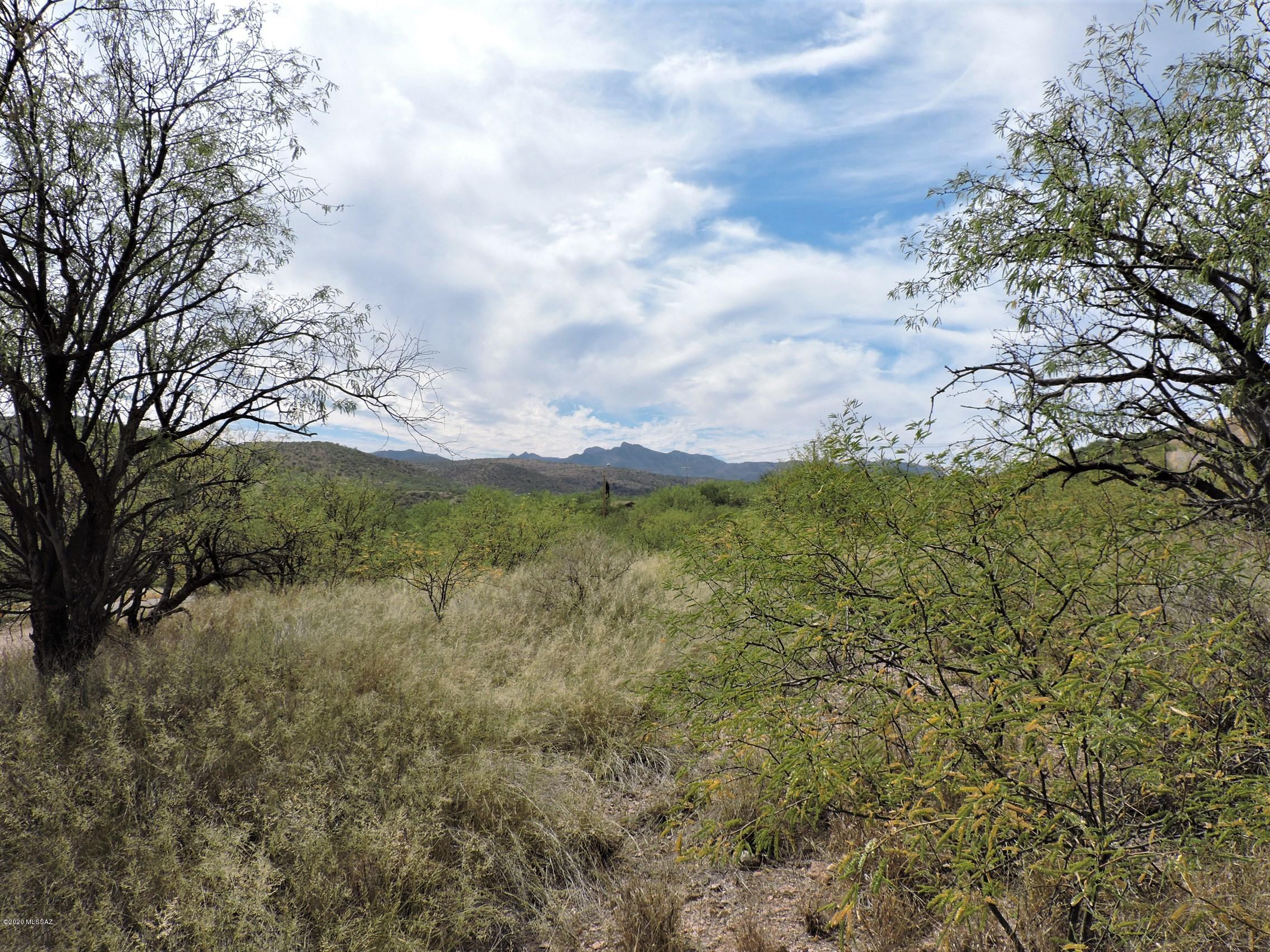Great lot only 2 miles to Peck Canyon Freeway entrance and 110' from Circulo Sombrero which is paved..  Views of the  mountains and easy build.