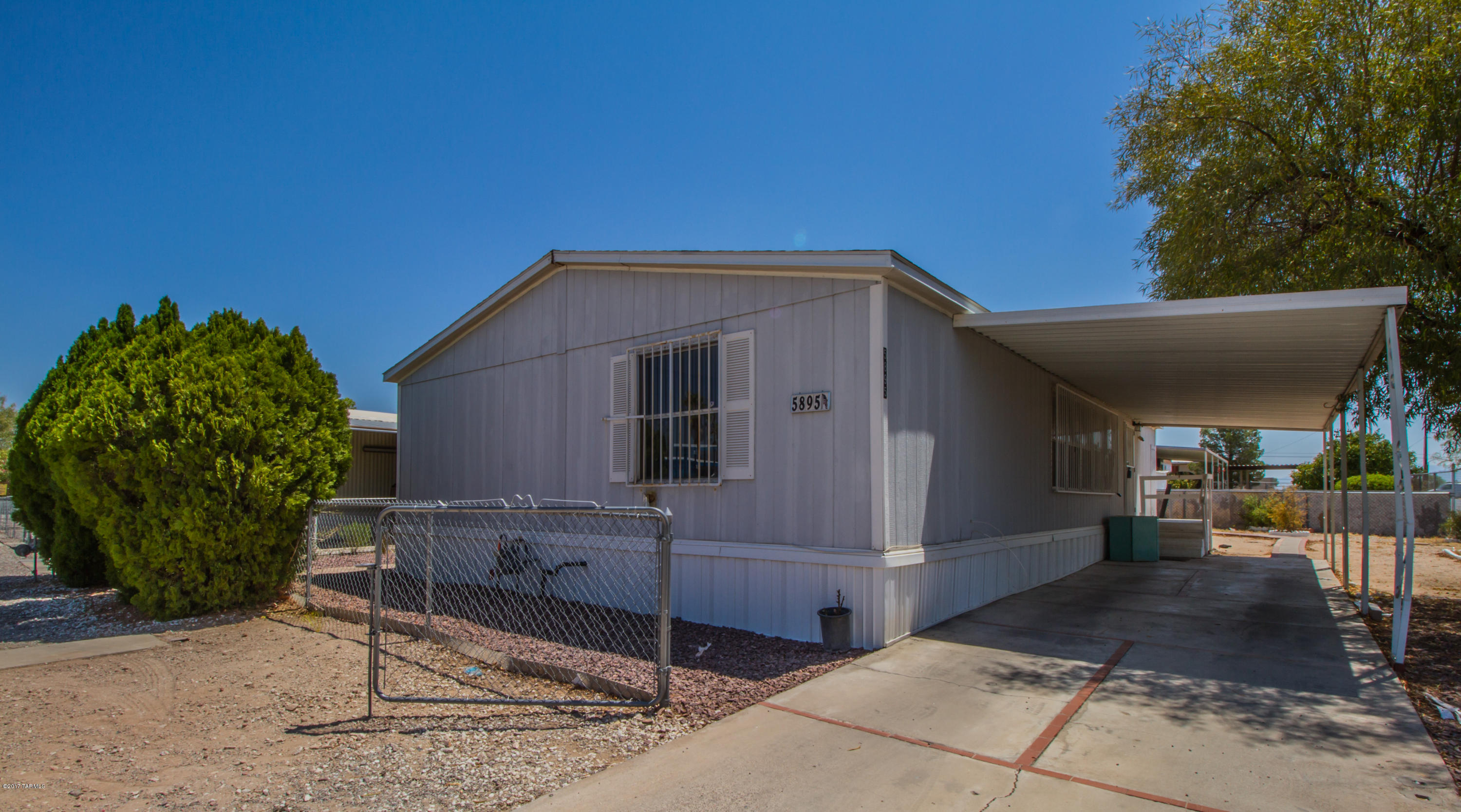 Seller will accept or counter offers from $69,900-$74,900. Great investment opportunity! Spacious three bedroom, two bathroom manufactured home, boasting a split bedroom floorplan. Home sits on a large lot with a paved driveway and large carport! Large and open kitchen with lots of cabinet space! With a little TLC this home will really shine!