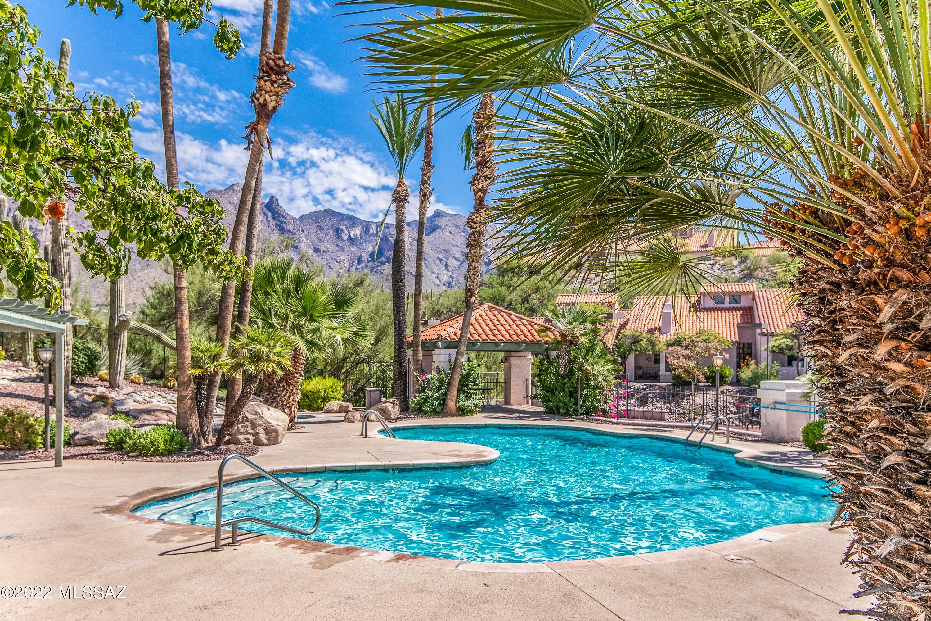 Spacious fully furnished 2-story condo (ground floor entryway) located in the popular resort style community of Tierra Catalina Condos. This charming Northern Tucson property features high ceilings, expansive windows providing an abundance of natural light, roomy Primary bedroom located on the 2nd floor, covered patio, breakfast bar, washer / dryer included, plenty of guest parking nearby and convenient location near La Encantada Mall and the Skyline / Campbell shopping corridor. The Tierra Catalina Condos include a heated pool & spa, clubhouse, exercise facility, tennis / pickleball court, bbq grills, and professionally maintained grounds. CALL FOR SEASONAL RATES & AVAILABILITY.
