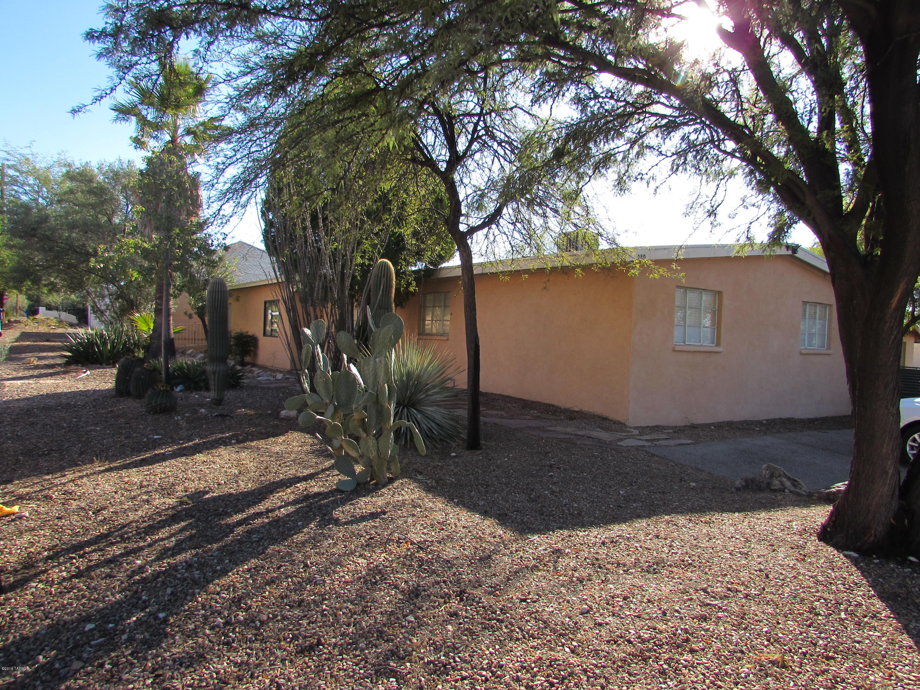 2 homes for the price of 1 within walking distance to the UofA! Front home features 5 bedrooms, 3 bathrooms, 1,820 sq. ft & nicely updated.  Kitchen features tons of cabinet & tile counter space & island.  Tile floors, updated bathrooms & so much more finish off this great property.  Guest house features 3 bedrooms, 1 3/4 bathrooms & 1,076 sq. ft.  Front unit rents for $2,225/mo & back unit for $1,400/mo.  Low maintenance for each property & a great investment opportunity! Plenty of off street parking for both units.  Great student rental or could be elder care center or live in one home and rent the other out.