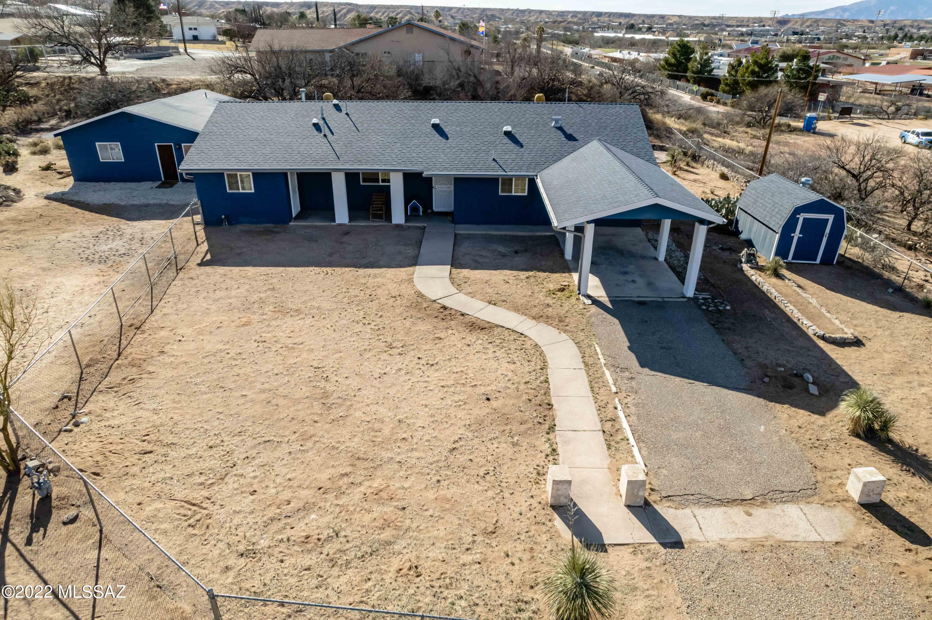 Welcome to the Beautiful Benson!  This home is located in one of the most desirable areas in town.  A large lot with plenty of room for a large family!  The home features 4 bedrooms, 3 baths, an open kitchen into great room and dining area, large master bedroom with attached office, additional bedroom with it's own bathroom, covered parking and patio, 2 bed 1 bath guest house, views looking all the way to the Dragoons and includes many updated features.  The home has an Ecobee Smart thermostat, Arlo Security System with 5 camera's and shed that will convey.  Fully fenced yard for all the pets.  Call TODAY to schedule a showing!
