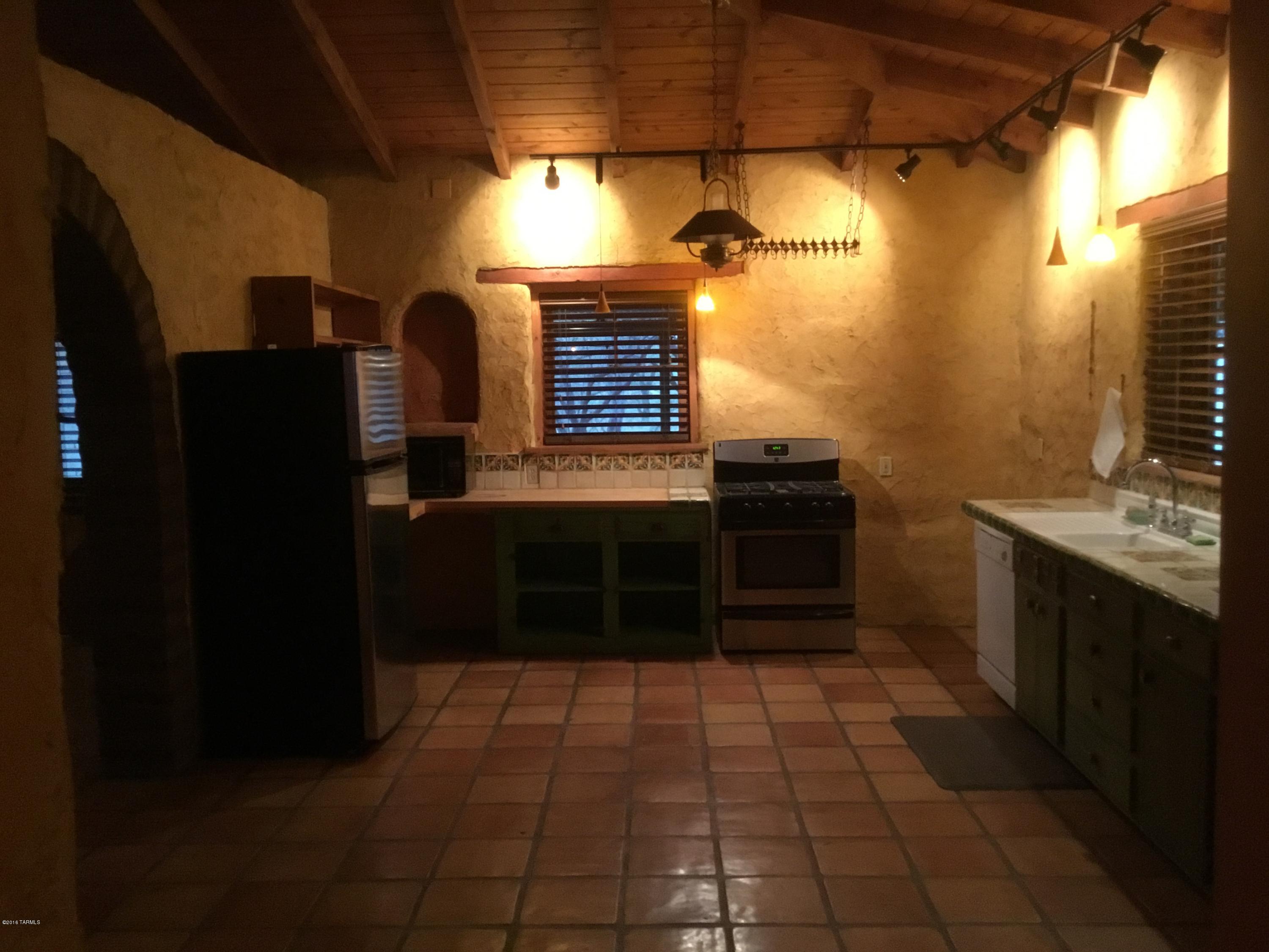 Very private Custom unique Mud Adobe built home on the banks of Harshaw Creek.*14.68 dramatic wooded acres complete with sunset & mountain views.1 bedroom,1 bath,Satillo tile floors,rustic wood ceilings,custom Mexican tiled accent kitchen with appliances.Enjoy the evenings on the screened in patio listening to the birds.Work shop with covered parking on the property.3 miles from Historic downtown Patagonia.Great vacation home!Room for horse & minutes to Coronado National Forest. Call for details.