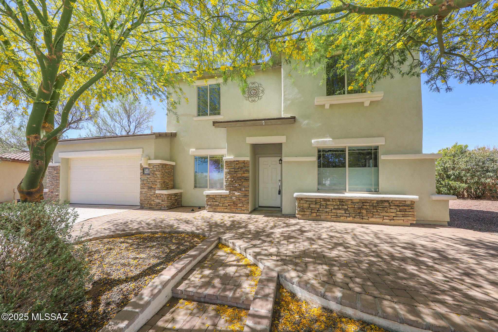 In the subdivision of Presidio De La Madera at Rancho Sahuarita, this home will have everything you need. Walk into 2,573 square feet of living space of FIVE bedrooms, 4 baths, 2 car garage, and one of the largest backyard lots with no neighbors behind. Downstairs has no carpets, a formal dinning area, living room, half bath, family room that is opened to the kitchen, and bedroom with its own full bath. The kitchen is spacious with granite counter tops, tons cabinets for storage with pantry, a perfect size island, and room for a breakfast table. Upstairs, there are 4 bedroom, and 2 bathrooms. The primary bedroom is large with its own sliding glass door to its own balcony, duel sinks, and huge walk in closet. All the bedrooms have ceiling fans installed. One of the best features of this home is its backyard, step outside to a gigantic space with a built in BBQ, large mature trees, a gate that leads to trails, and a fenced in area that can be used for pets or a new garden. Home is close to Sahuarita Lake and the club house.  Come see TODAY!!

Possible loan assumption for VA eligible buyers.