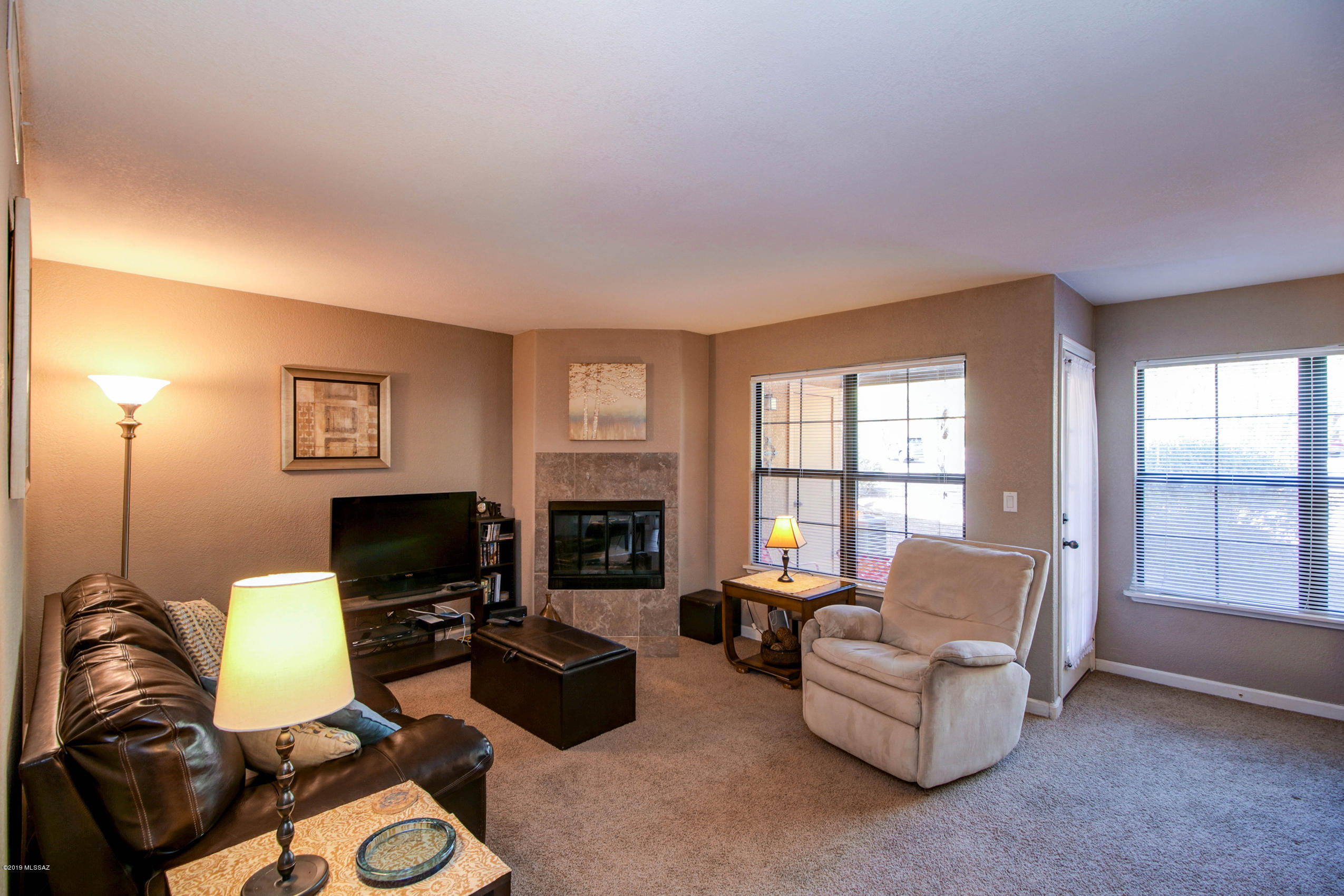 2bed/1bath condo in North Tucson condominium in the Skyline Villas community. Open floor plan with dining area, living room including fire place and private balcony, Kitchen features upgraded cabinets and pantry. Master suite includes walk in closet. Washer and dryer included. Enjoy the community pool, spa, and tennis courts. The condo can be rented fully furnished and equipped for an extra $100 a month (no utilities included)