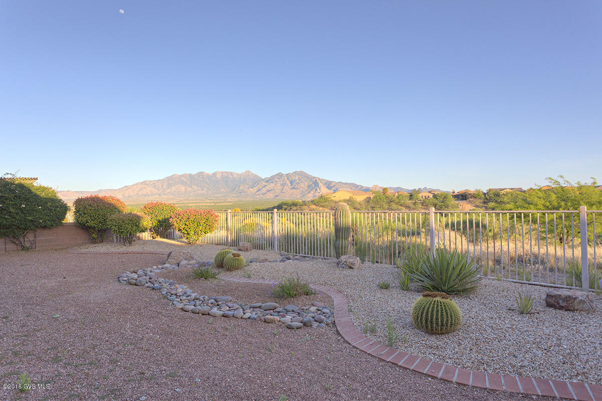 Bonita above the golf course with amazing views!!! All tile floors, granite kitchen countertops. Everything you want and more...even an extra large garage. All options and upgrades are first class! A gated community with only 30+ homes. 2 bedrm, 2 bath, den, great rm, large covered patio and easy care landscaping front and back. A truly lovely home. With a magnificant view