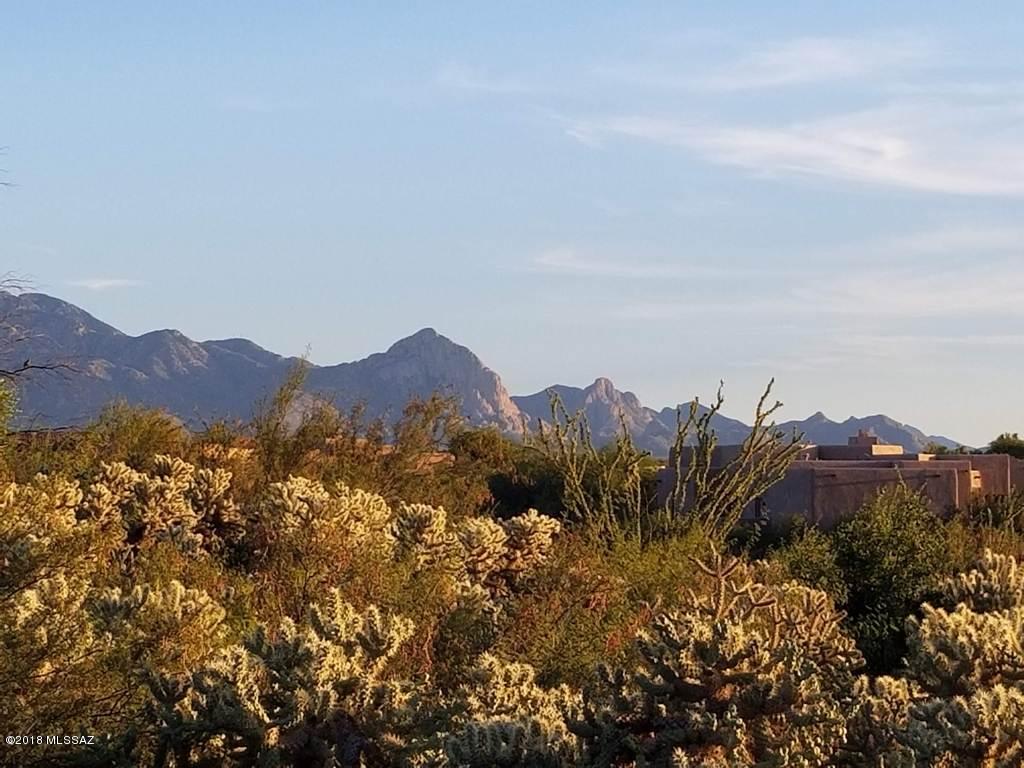 Seller drops price $10,000! Surrounded by half a million dollar + homes. Premium, easy to build .75 Acre residential view lot will accommodate up to a 3000+ sq. ft. house, plus 3 car garage, pool. It's your dream. Come live it. Excellent panoramic views of the Santa Rita Mountain Range and adjacent to a huge lush desert arroyo.  Madera Reserve is an upscale, all age community in Green Valley boasting valued amenities such as all underground utilities, dedicated sewers and streets, natural gas, carefully thought out covenants and 3 miles of hiking trails through pristine desert. This is desert living at it's finest.  Choose your own builder and time frame to start. Call or visit today. Initiating  membership to Green Valley Recreation is optional on this lot.