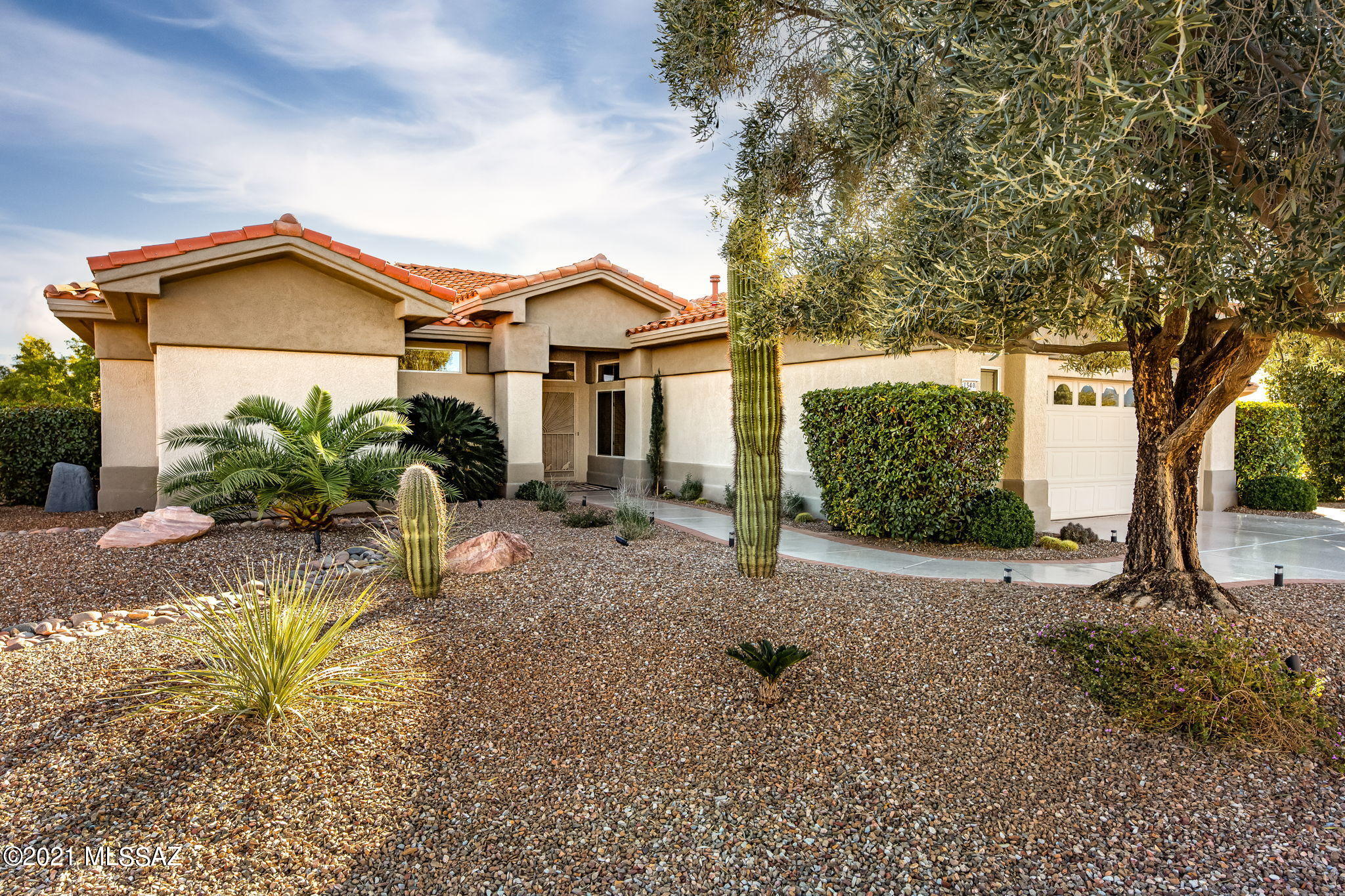 If you are looking for resort style living, look no further!

This Magnificent Modern 2,086 SqFt, 3 BD, 3 BA home is located in the Premier Active Adult Community, Sun City Oro Valley, and is Spacious, Remodeled, and Ready To Move Into! 

You will be delighted by how bright and beautiful this spacious open concept plan is, boasting Catalina mountain views, clerestory windows, high ceilings, and modern finishes throughout.  

This property is pristine inside and out and features an expansive living room, open kitchen with gas cooktop, stainless appliances, granite countertops, bar seating, bay window, and a large dining area with back porch access. The master bedroom is spacious and offers outdoor access as well, and features a large walk-in closet and ensuite bath with soaking tub, separate shower, and duel vanity with vessel sinks. Guests will love the second bedroom with its newly added ensuite bath with shower. The third bedroom with double doors offers ample closet space and is perfectly suited to be utilized as a den or home office, with easy access to the hall bath with tub and shower. 

The large laundry / mud room with built-in storage is located off of the kitchen and accesses the garage, featuring an epoxy coated floor, built-in storage cabinets, work bench, utility sink, and access door to the side courtyard. The side courtyard provides a tranquil space with a small private patio, beautiful shade tree, and turf. 

Whether you are ready to relax or entertain, you will thoroughly enjoy the fabulous outdoor living space with South exposure, boasting Catalina mountain views, a large covered porch with expansive paver patio, fire pit, seat wall, and meticulous landscape with outdoor lighting.

This beauty is truly a one of a kind, and is ready to welcome you home!
