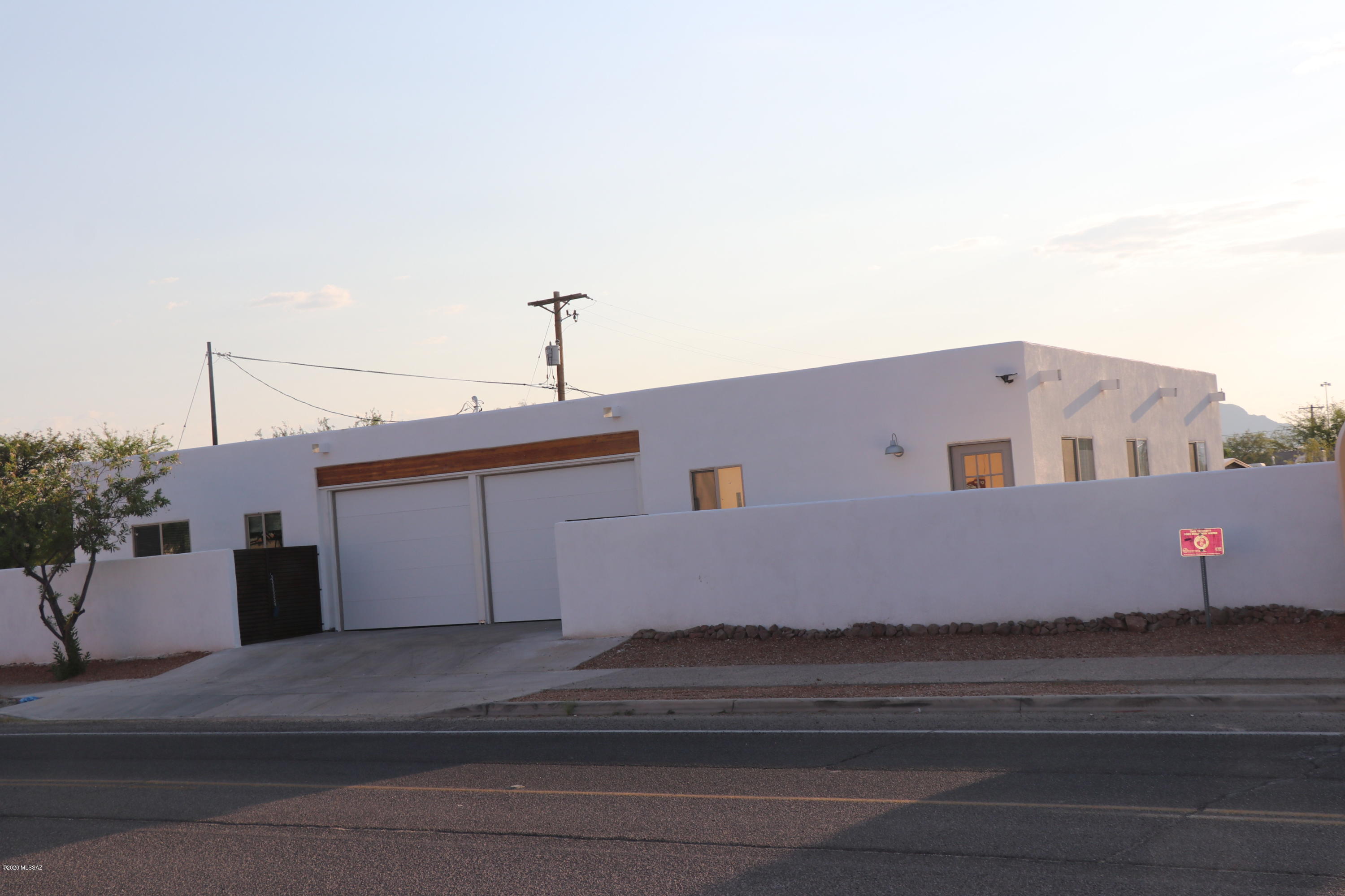 Designers vision of an Urban retreat with  function and style. Skillfully sited on walled in lot, with  artistic rusted accents. Perfect access to downtown amenities, freeway and walking  distance to restaurants blocks away.  Home features granite counter tops, tiled plank floors and   4 Brs split plan eparated by 2 car oversized garage   ''A'' Mountain, a Tucson landmark. 
 If you seek an urban lifestyle home,  you will appreciate this Modern  floor plan.
 Use the Casita for  Airbnb or artist studio , guest quarters or parent/kids etc
Courtyard setting in a neighborhood with murals and blocks away from  Mercado San Agustin, and Gem show corridor. 2-10 new construction builder warranty . Seller may pay a  portion of buyers closing cost!