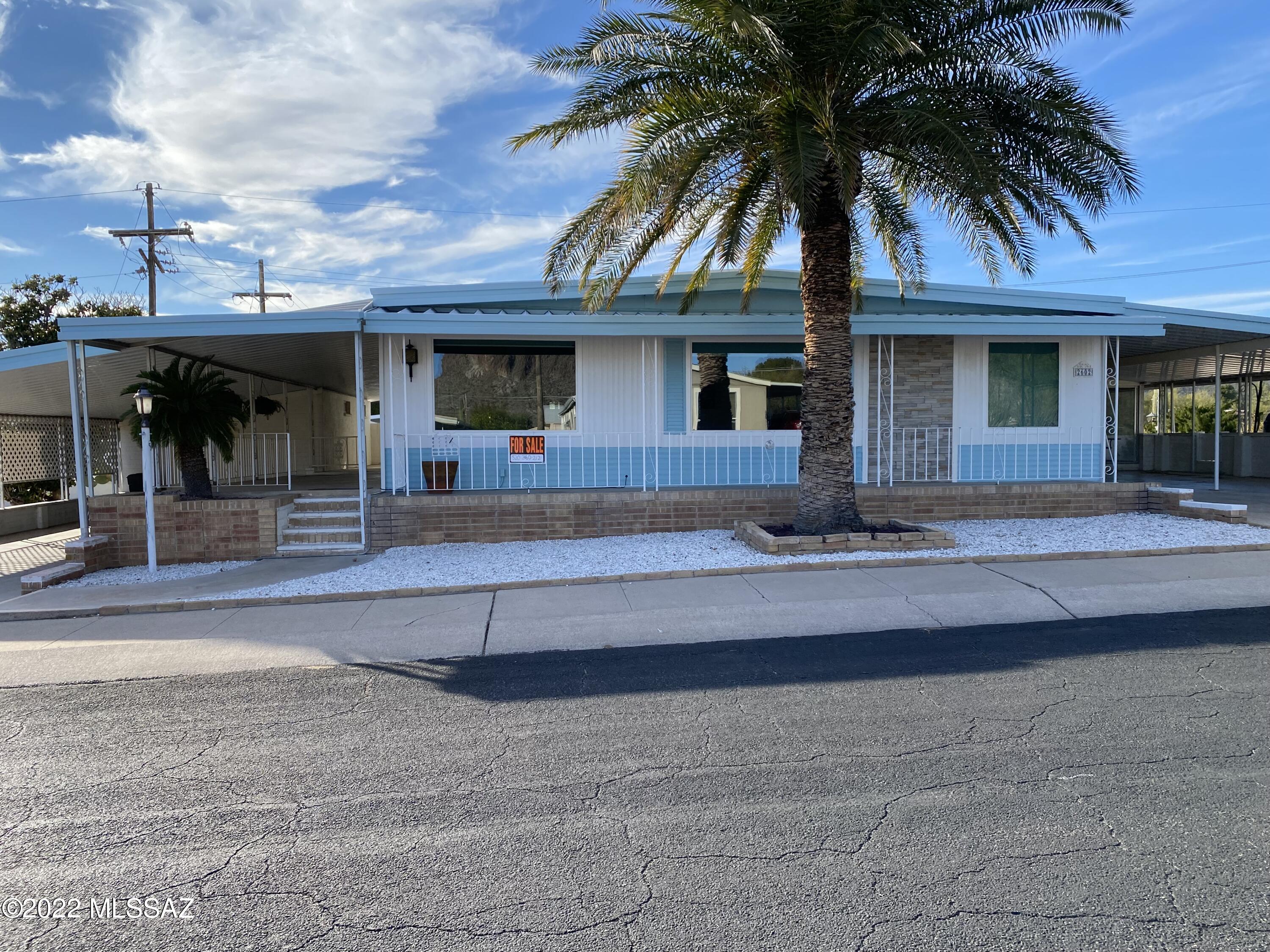 55+ community with 18 hole executive golf course for owners--HOA also includes tennis, pickleball, exercise room, spa, 3 pools, shuffleboard and many other numerous activities. Arizona room( not included in square footage) and a brick storage room, 14x22 which can be converted to a perfect ''Man Cave''. The Arizona room looks out on the 10th tee and the Tucson Mountains. This upgraded home, with ample parking is spacious and has wonderful views and outdoor patio areas to entertain or just relax and enjoy the wildlife and beauty of the desert. Must See!!

.