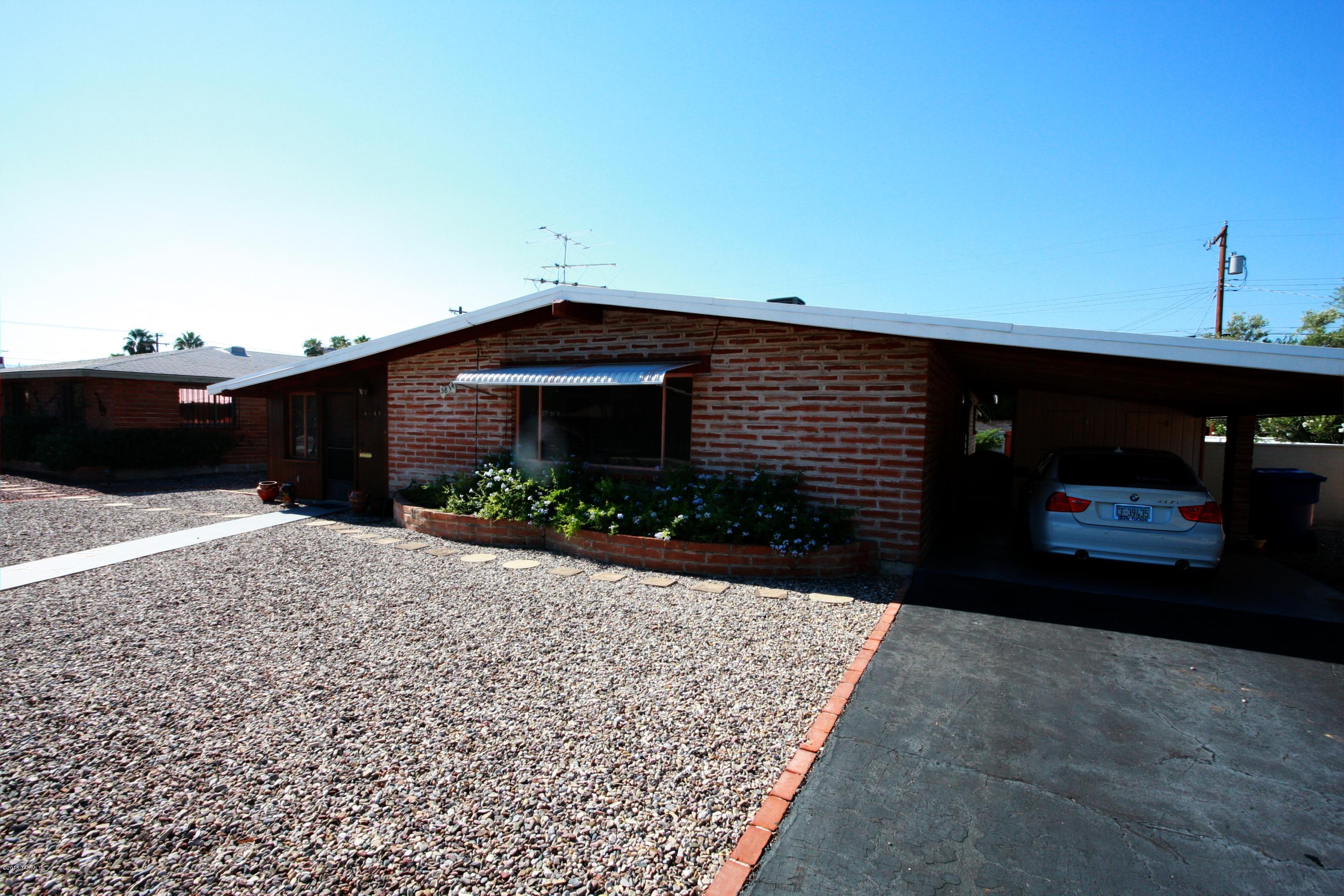 Lovely brick home with fireplace and beautiful backyard. This Central Tucson home is located close to shopping, schools, hospitals, Wal-mart and dining, you won't have to go far!
