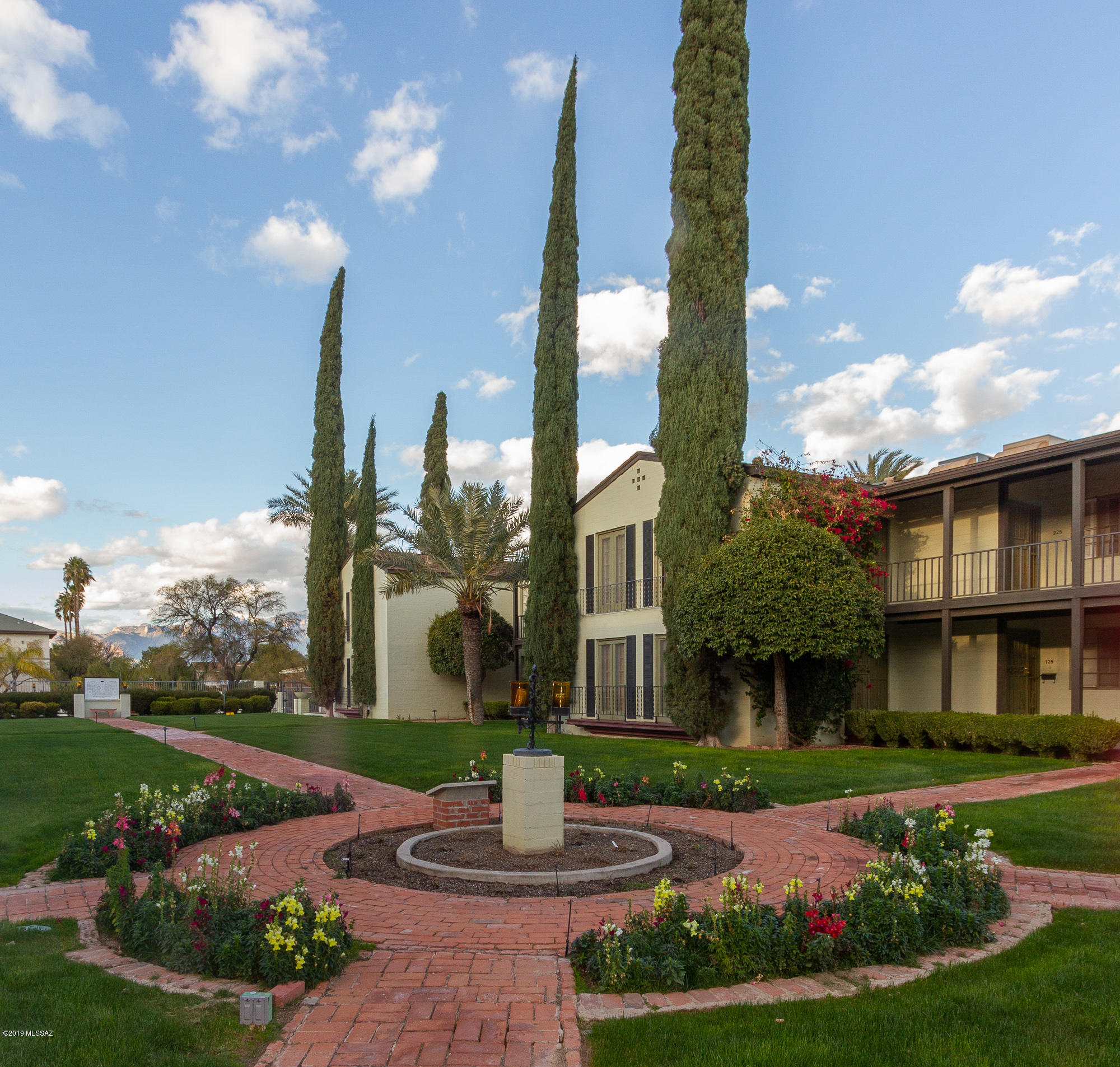 UofA location. Historic El Encanto Apartments Sam Hughes. Private 2nd floor unit, Catalina Mountain views with large floor plan. Great room fireplace. Major Kitchen, updates. Appliance warranties transfer. Original bathroom tile, new tiled floors. Formerly a 3 bedroom, previous owner took out a wall to make it a 2 bedroom. Can be changed back to 3 bedroom. Mid-town serenity with front and rear private patios. The HOA covers garbage, pest control, maintains the grounds, pool, roof, building exterior, common area utilities, water/sewer & laundry facilities. The home includes full sized washer and dryer. 2 pets are allowed.