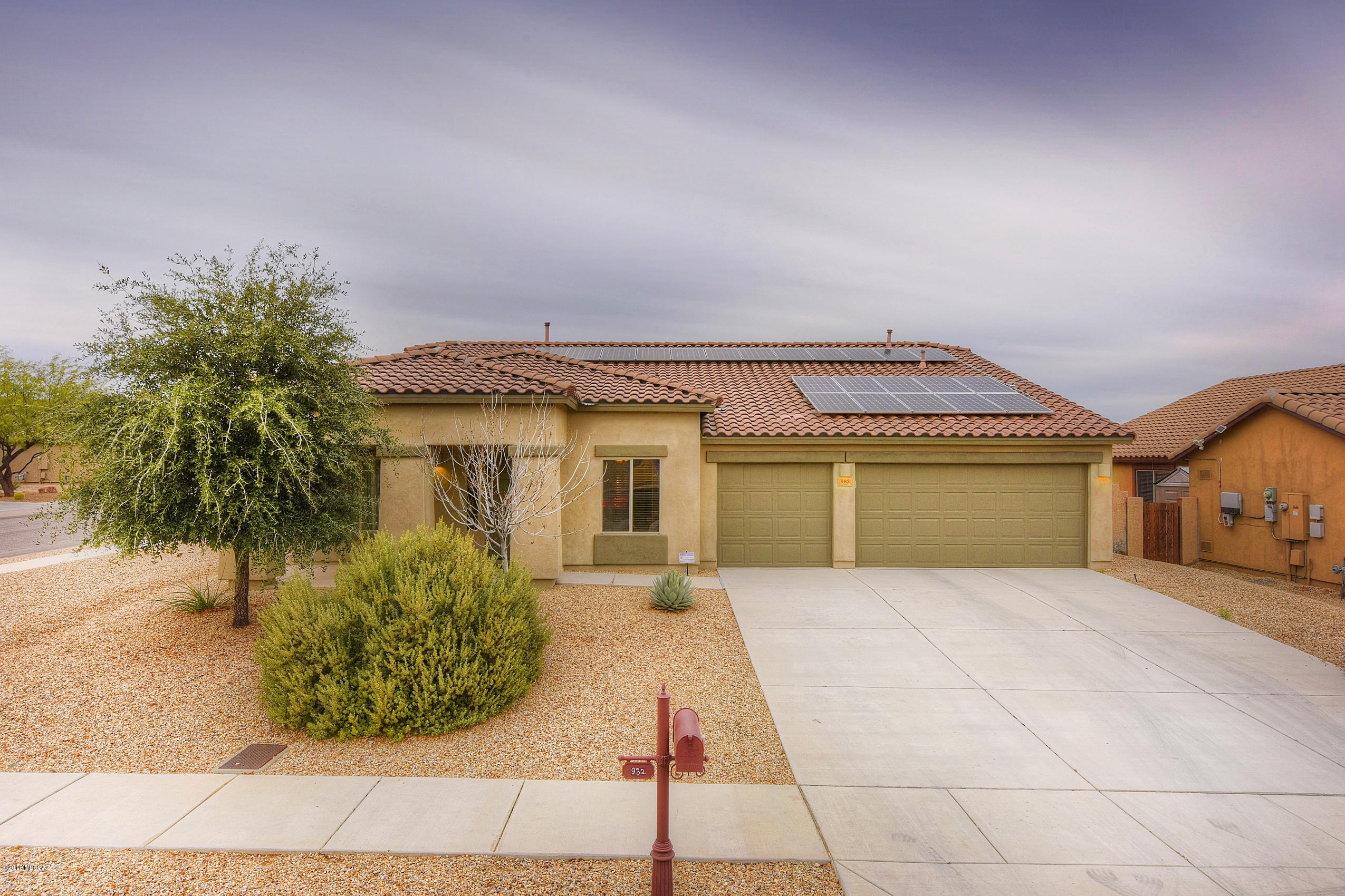 Quality built DR Horton home with one of the largest single story floor plans in the Presidio Del Saguaro section of Rancho Sahuarita. Features include split bedroom floor plan,premium corner lot and a 3 car garage. Also enjoy a fully tiled great room, granite counter tops in kitchen, and stainless steel appliances. The backyard features low care landscaping and a large tiled bar that is ideal for entertainment.   Solar Panels are owned and payed for so the new owner can start enjoying the energy savings!