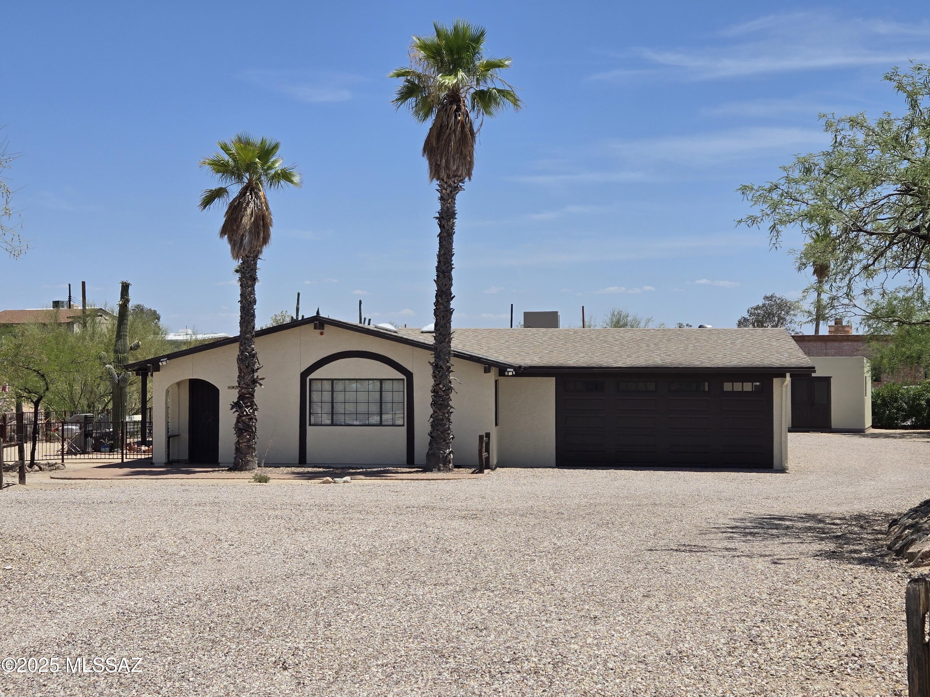 This is a must see property with fantastic Catalina Mountain Views. The home offers an open and bright Living Room and a Kitchen that has granite countertops with  plenty  of cabinet space. Kitchen overlooks the Family Room which is perfect for entertaining. This 3/4 of an acre property is very private and has full RV Hookups and a 300 sq ft insulated Workshop. Enjoy sitting on the covered back patio with beautiful mountain views. The A/C is 3 years old and the home is move in ready.