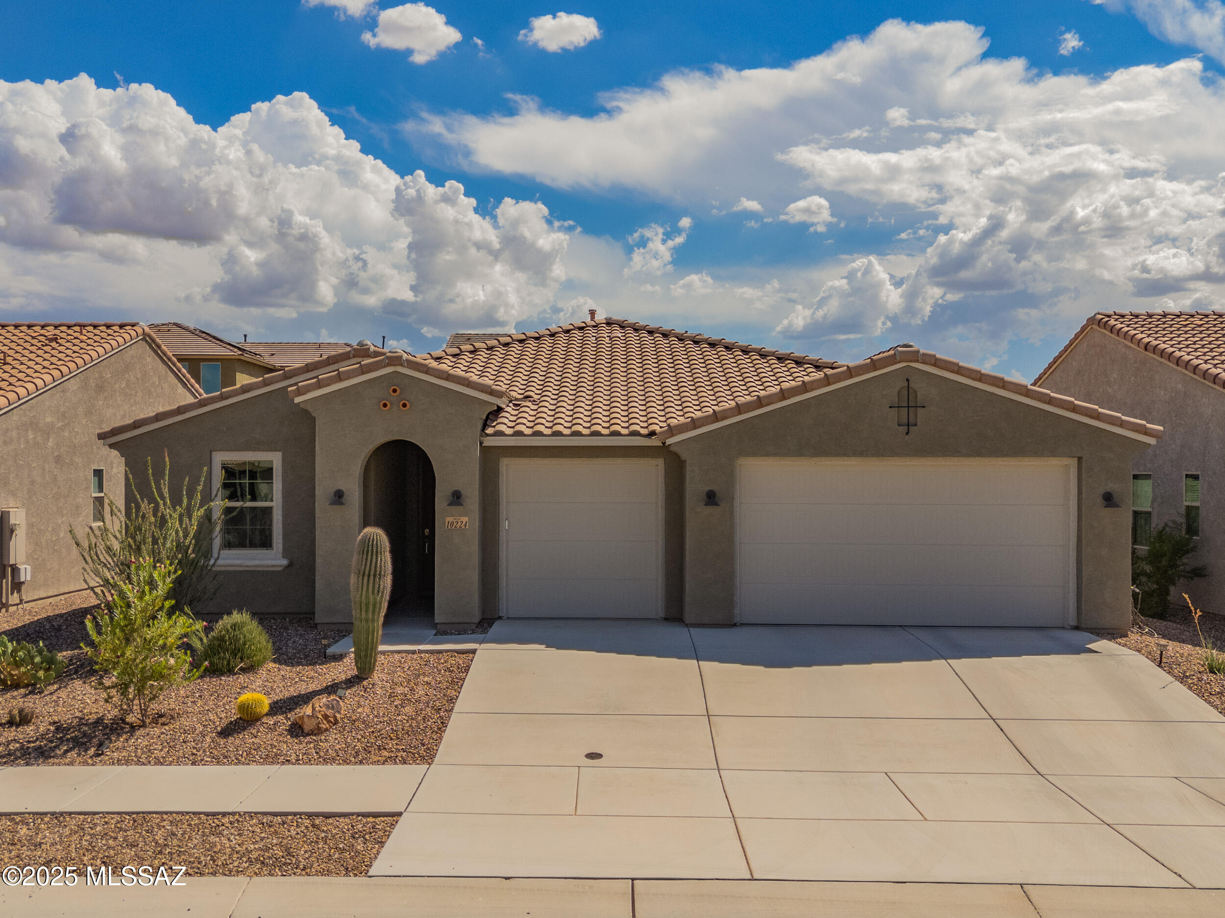 Value priced!  This 3/2 2019 build is one of Mattamy's most highly desired contemporary split floor plans and it's on one of the largest lots.  This gem is spacious, light and bright, and has an open concept layout with an additional family room providing ample options for everyone to have their own space.   As you walk in you will appreciate the elevated finishes throughout including 8ft upgraded doors as well as ceiling fans in every room!  The great room boasts large living and dining areas as well as a gourmet kitchen with white crown-molded shaker cabinets, granite counters, expanded backsplash, a large counter-height island with pendant lighting, SS Samsung appliances including a 36'' gas cook-top with wall-mount hood and a glass door walk-in pantry. Access the backyard via a slider, entertain under the expansive covered porch and enjoy peek-a-boo rincon mountain views from the low-maintenance paver backyard.  Also off the great room, you'll find the oversized family room with great flex space for your specific needs (e.g., 2nd living room, home office, work-out space, game room etc.)   The spacious primary suite retreat overlooks the well-appointed low maintenance backyard.  The spa-like primary bath enjoys a dual vanity with granite counters, a garden tub, separate shower and access to the large walk-in closet...and bonus access to the laundry room!  On the other side of the house, the two very large private guest bedrooms share a large hall bathroom with an extended vanity, granite counters, tub/shower combo and lots of storage!  Don't miss the gigantic 3 car garage with 8ft doors and additional extended bump-out that will fit oversized vehicles. New HVAC installed 2024!  This delightful community boasts a recreation facility, basketball courts, parks, hiking/walking trails, sport courts and a community pool/spa.  Highly rated schools, nearby shopping, proximity to the Sonoran Desert and easy access to Tucson International Airport make this a highly desirable choice!  Welcome home!