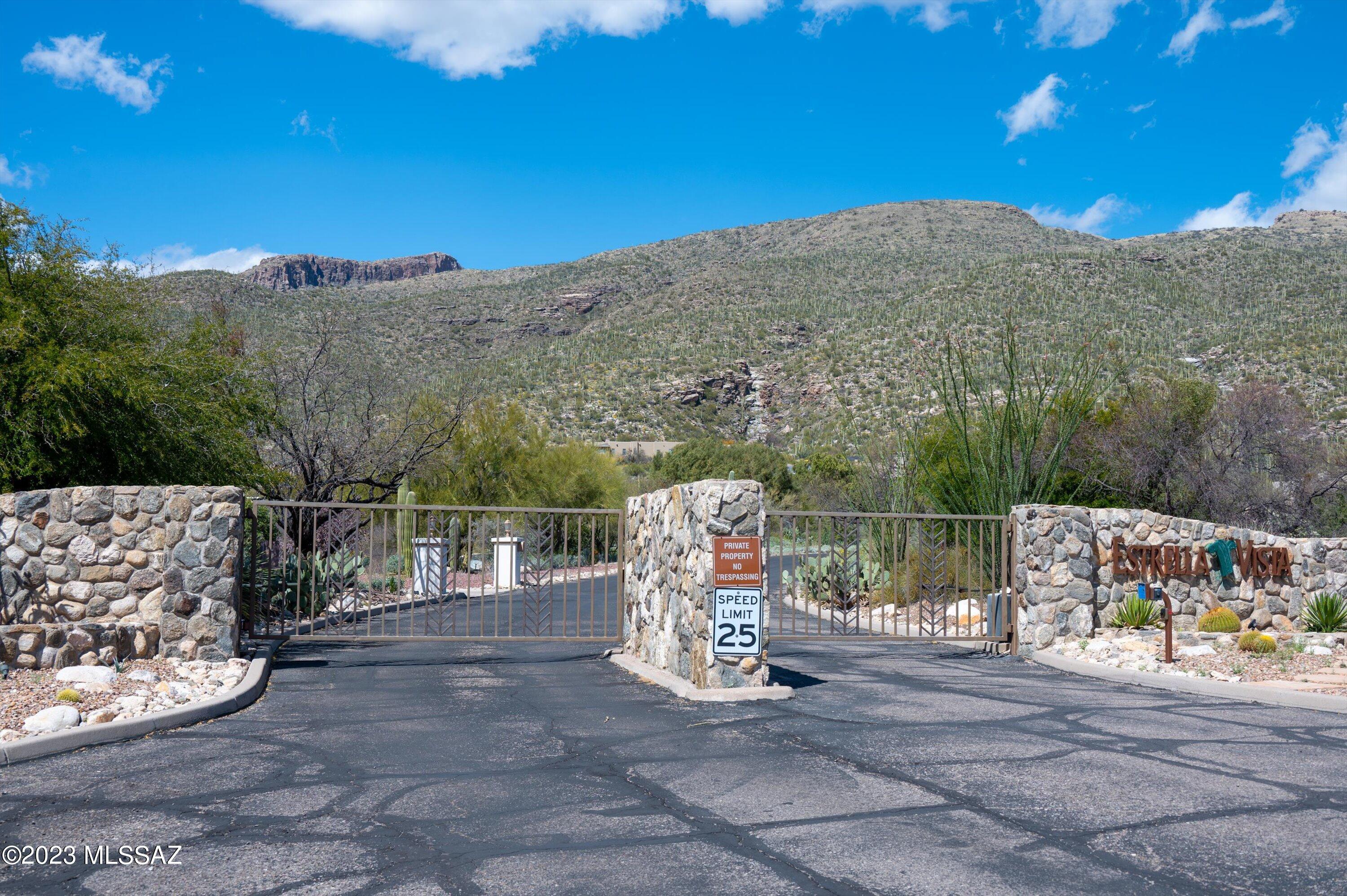 Exceptional 4.86 acre lot bordering the  Coronado National Forest. It is located within a gated community of Estrella Vista Estates (1-23) which is a very quiet and private community. This large lot will offer amazing views of the surrounding mountains and city, encompassing the sunrise and sunset. Only minutes from 2 golf clubs; Arizona National/Sabino Springs & Forty Niner Country Club.  This property is conveniently located near hiking trail, golf courses, restaurants and shopping.