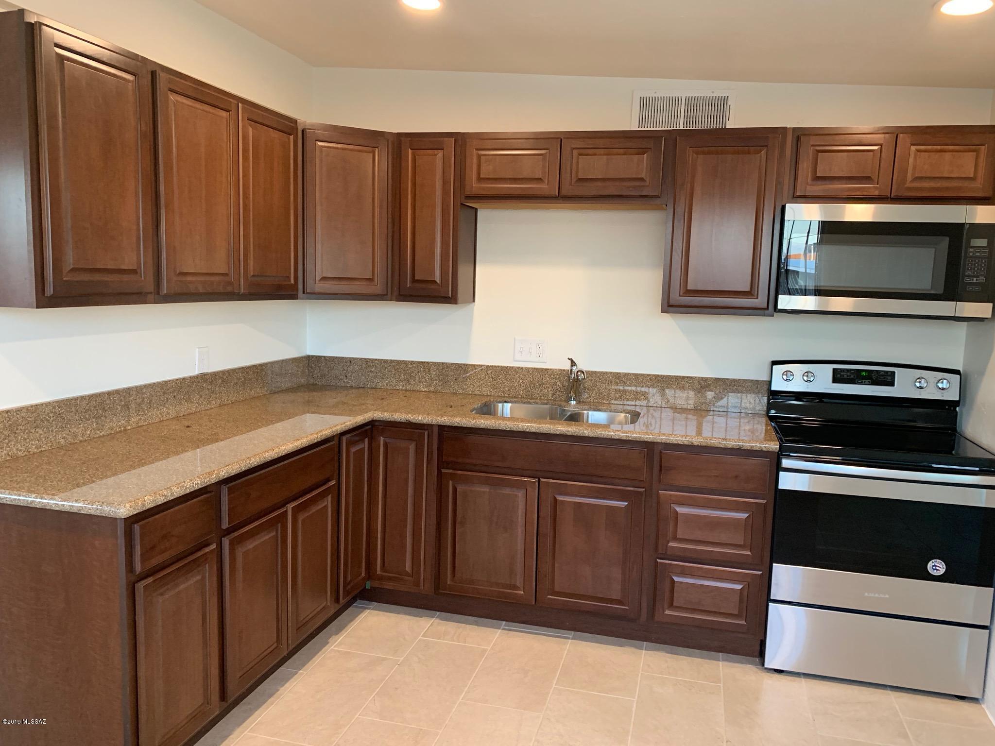 Beautiful townhouse ready to move in, fully remodel. Tile through out the house, new cabinets on kitchen with granite counter tops and new appliances. Both bathrooms with title showers and new cabinets. NO HOA! Property is a corner lot.