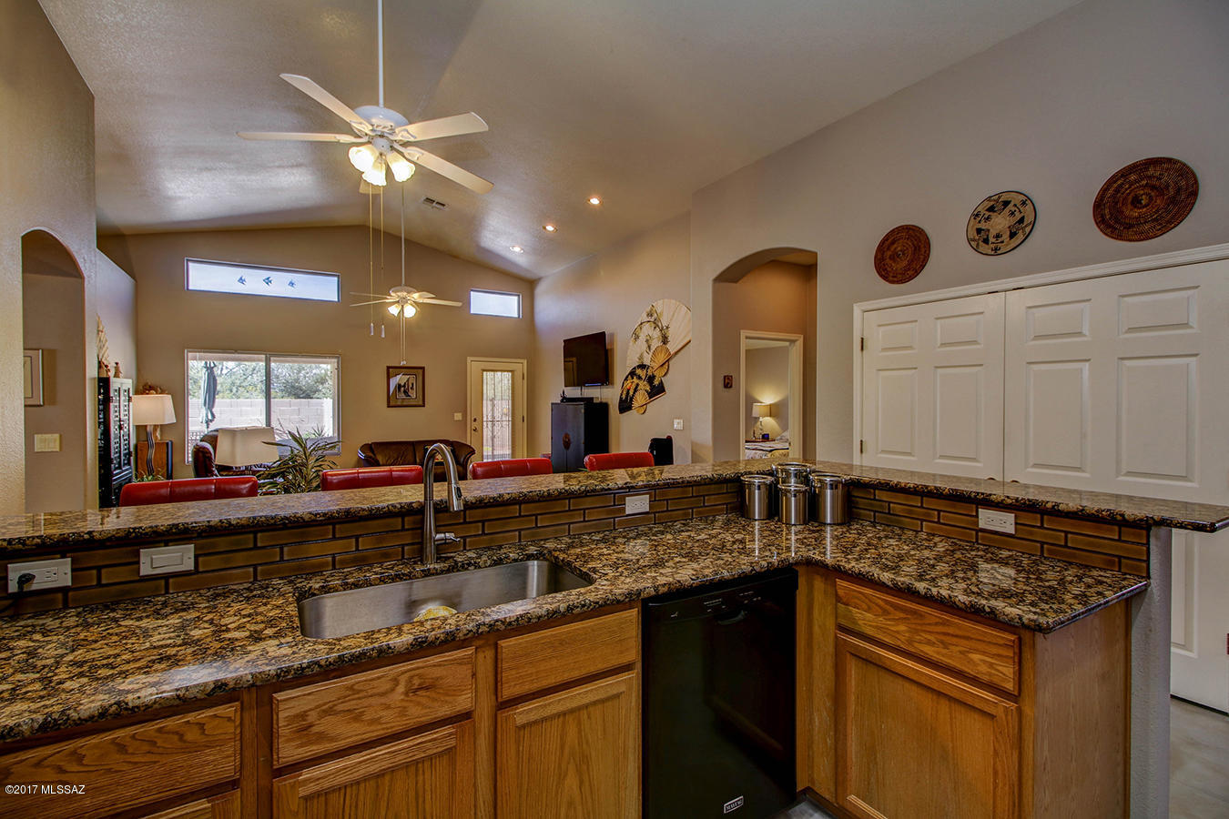 Living is easy in this spacious residence in the heart of Oro Valley. Enjoy gatherings in the generously sized living areas graced by neutral paint colors, vaulted ceilings & tons of natural night. 
This home with a split floor plan hosts multiple new upgrades: Concrete flooring, HVAC unit, dual flush toilets, maytag/whirlpool appliances, granite counter tops & mosaic back splash, new kitchen sink & disposal, under cabinet lighting & irrigation system. Near BASIS, Whole Foods, Golf Course & walking paths, this home has a massive office with a closet, giving you the option of a 5th bedroom! The low care backyard is perfect for entertaining with a gated pool & separate space for outdoor dining. Transferable termite warranty & leased solar panels to cut your electric bill by more than half.