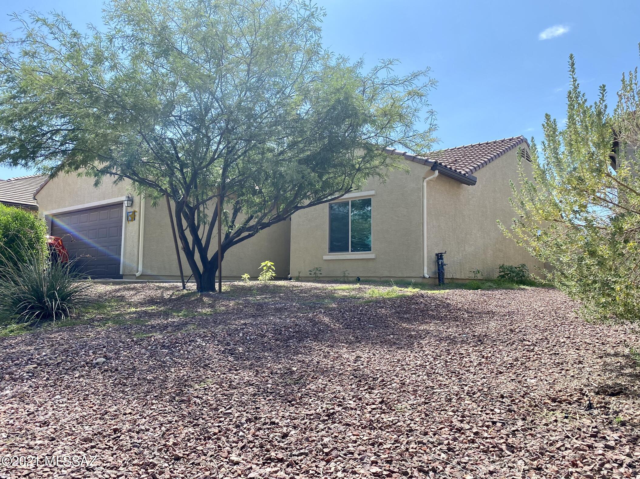 Spacious 3 bedroom 2 bath home that boasts an open floor plan, granite countertops in kitchen, large Island that opens to the living room that is perfect for entertaining, breakfast bar seating. Bay window, oversized closet in master bedroom.  Nice size backyard with extended covered patio.  Water Filtration system, Refrigerator, Washer & Dryer convey with home.
