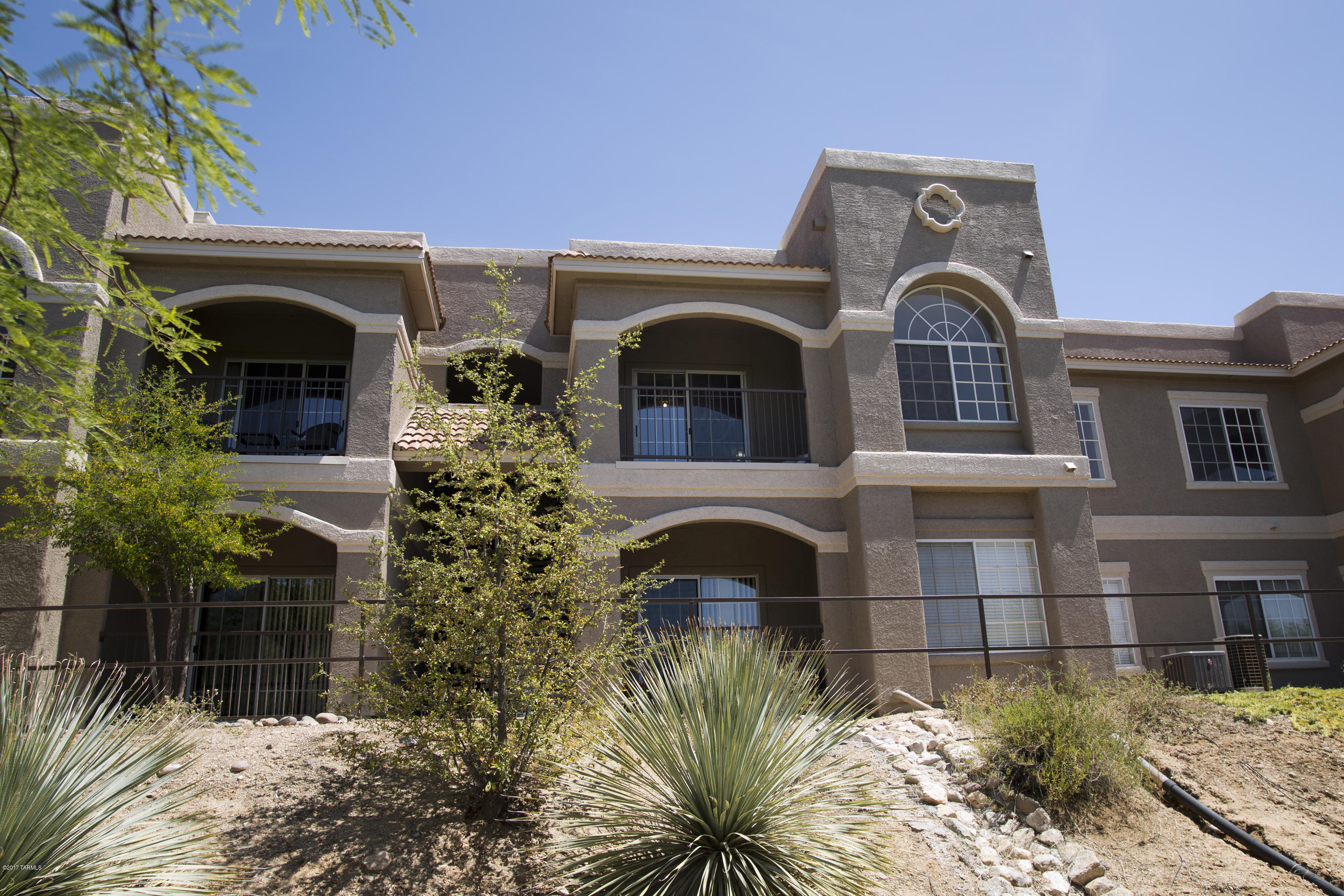 2nd floor, 2 bedroom, 1 bath condo in Boulders at La Reserve Condominiums with peaceful unobstructed view! Completely remodeled by current owner over time with upgraded custom cabinetry, granite tile countertops, brand new interior paint, composite wood floors and a custom wood dining room buffet/bar! Located near Catalina State Park, dining, and shopping of Oro Valley!