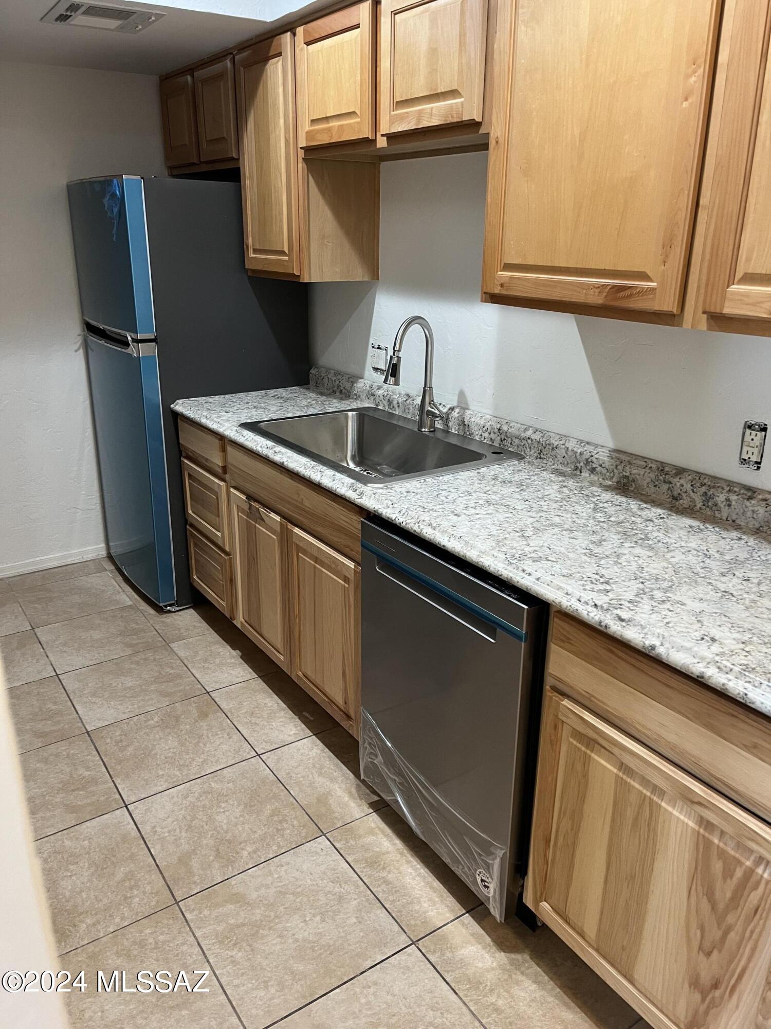 Newly renovated condo within gated community. Centrally located. Top floor unit featuring stainless steel appliances and new fixtures. Easy to clean laminate flooring throughout and tile in the bathroom. Great swimming pool in the complex. HOA includes water, trash, sewer, building maintenance and security. Complex welcomes short and long term rentals.